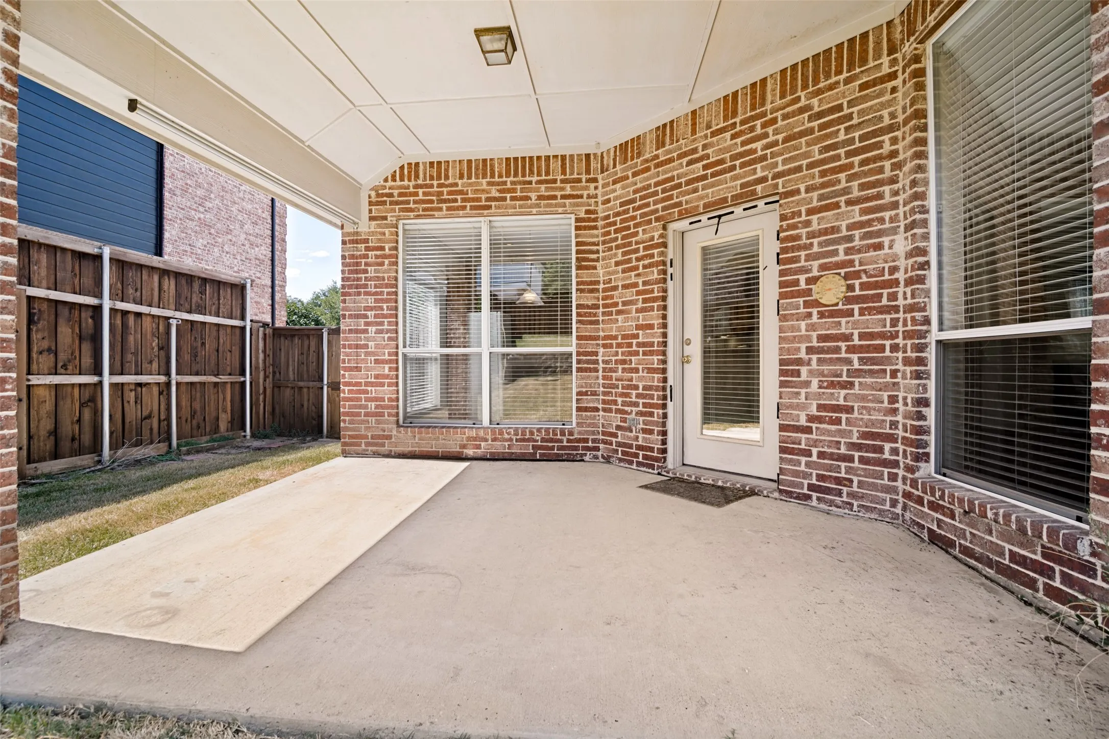 The huge covered patio is perfect for morning coffee or watching your family enjoy games together outside.