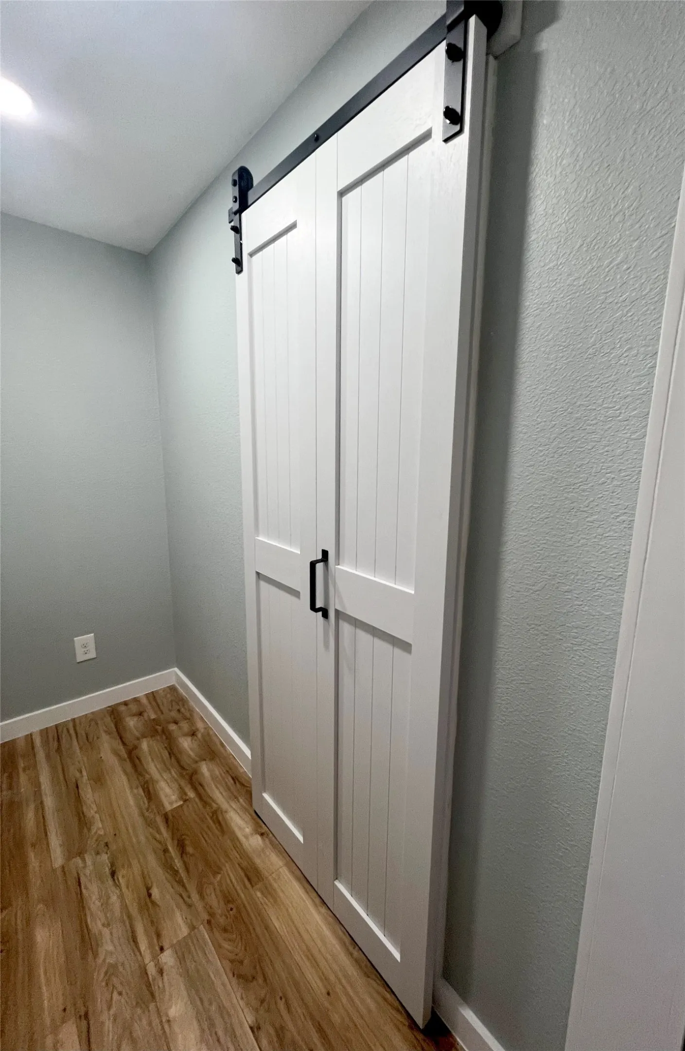 storage space and door to primary bathroom