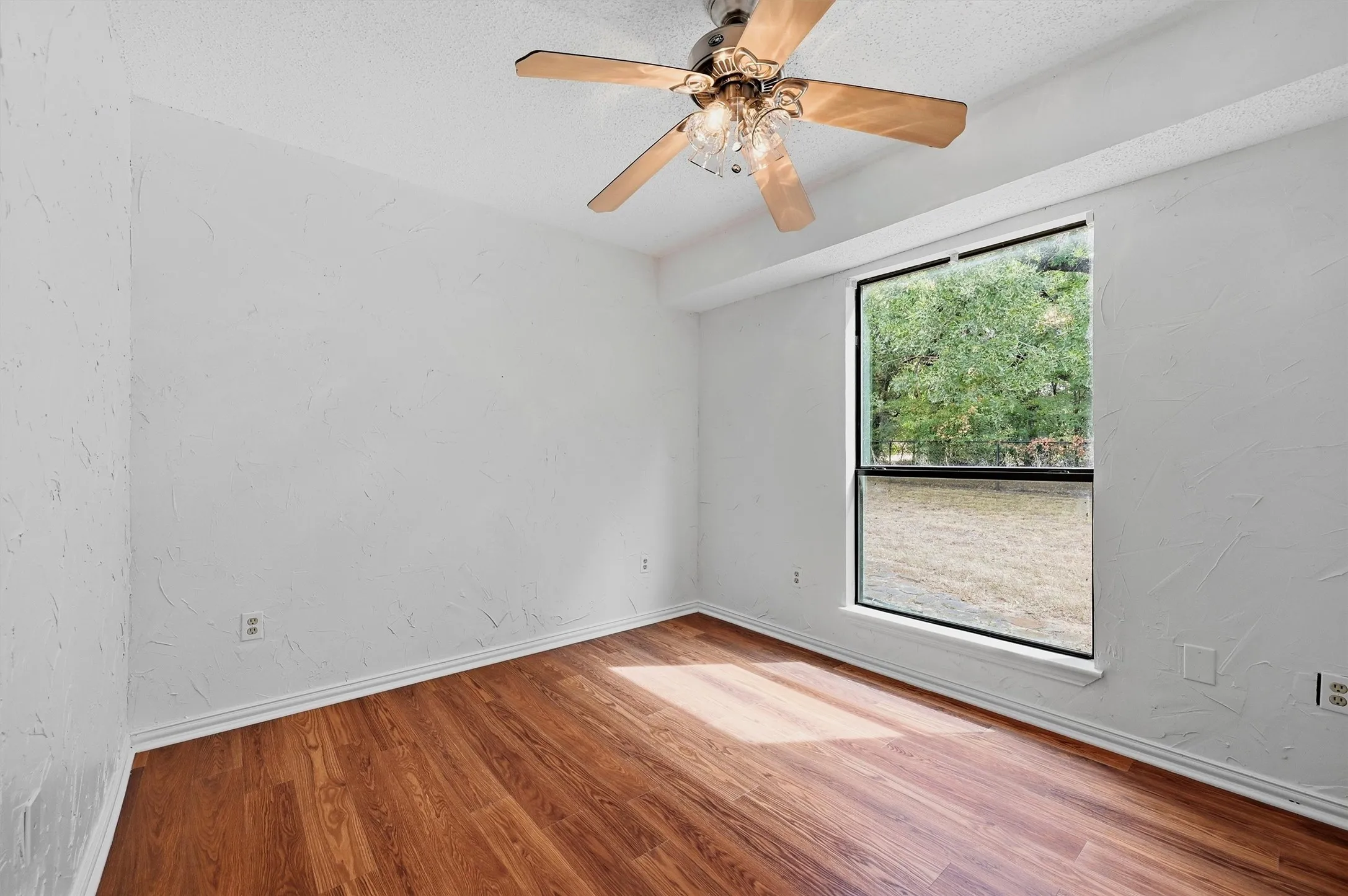Wood-look flooring and a large window