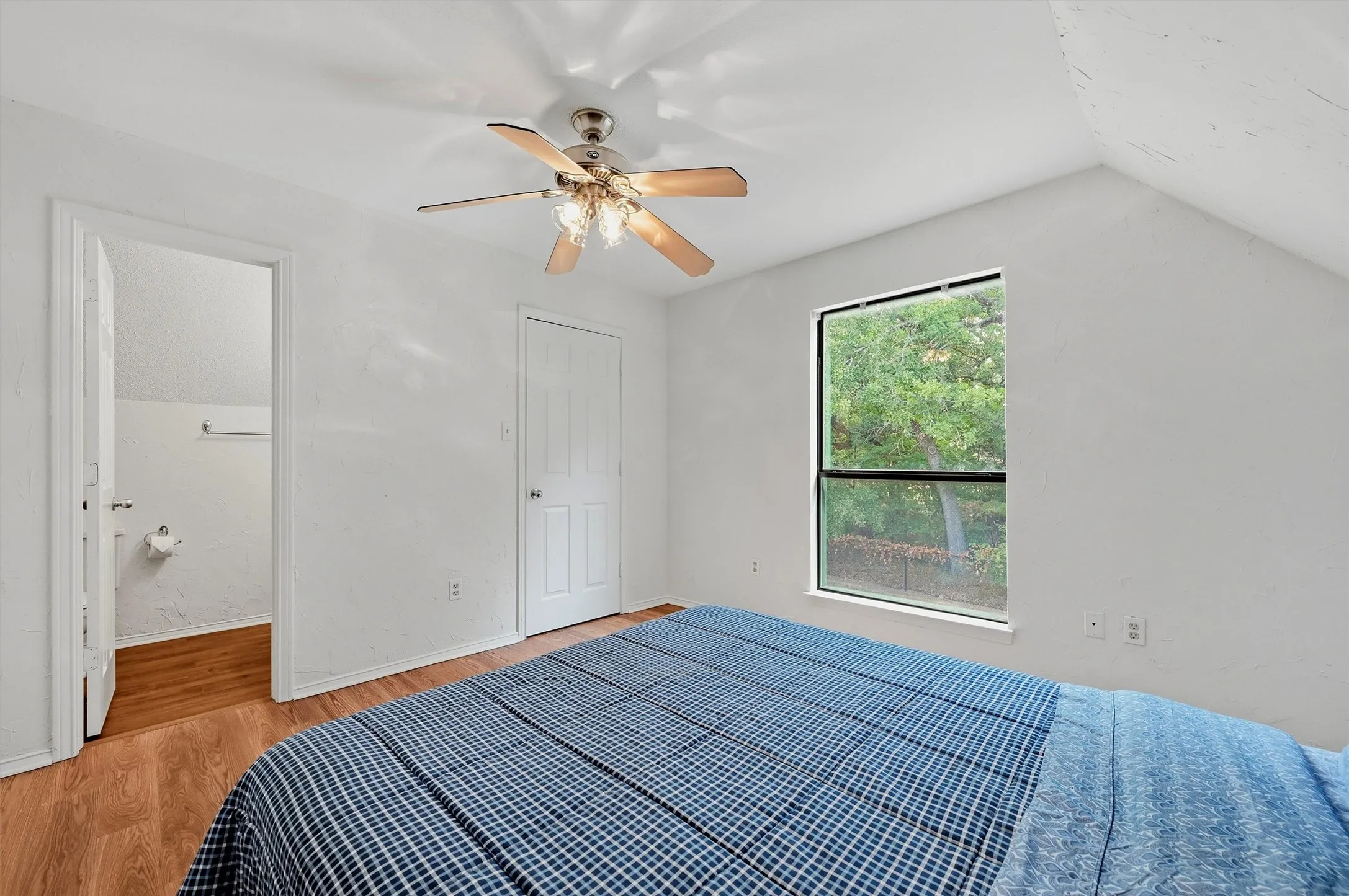 Level 2 bedroom featuring wood-look flooring