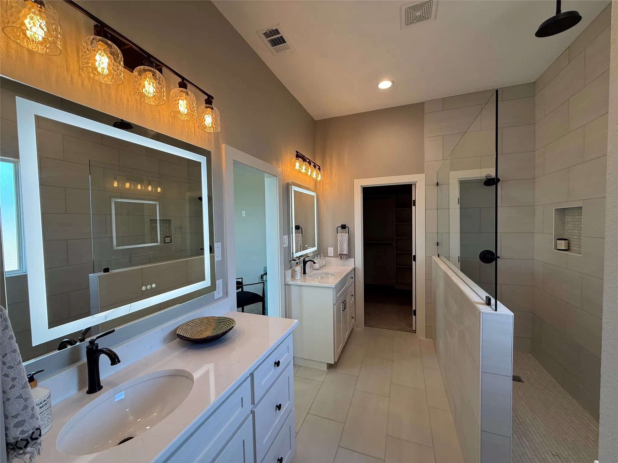 Double sinks for convenience & a walk-in shower!