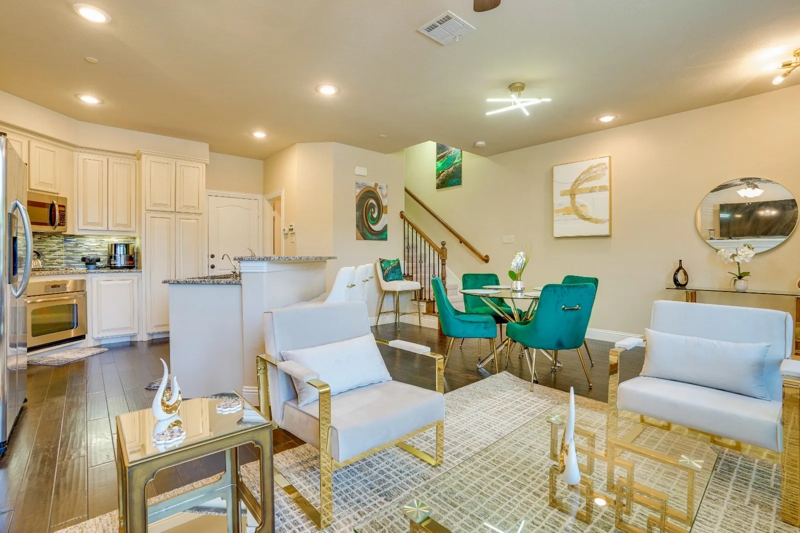 Open-concept living space with wood-finish flooring