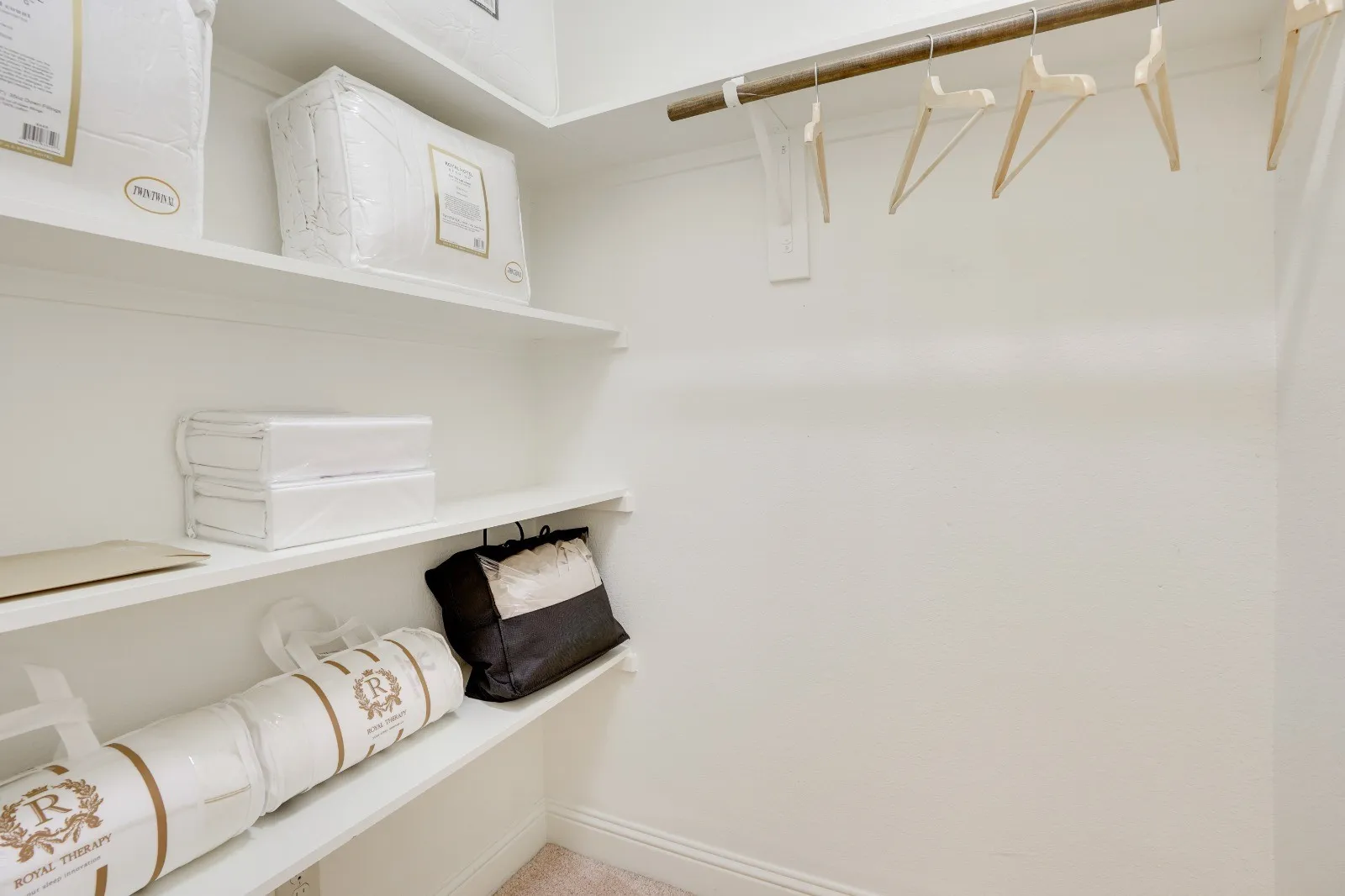 Built-in shelving, hanging rod, and wall-mounted light switch