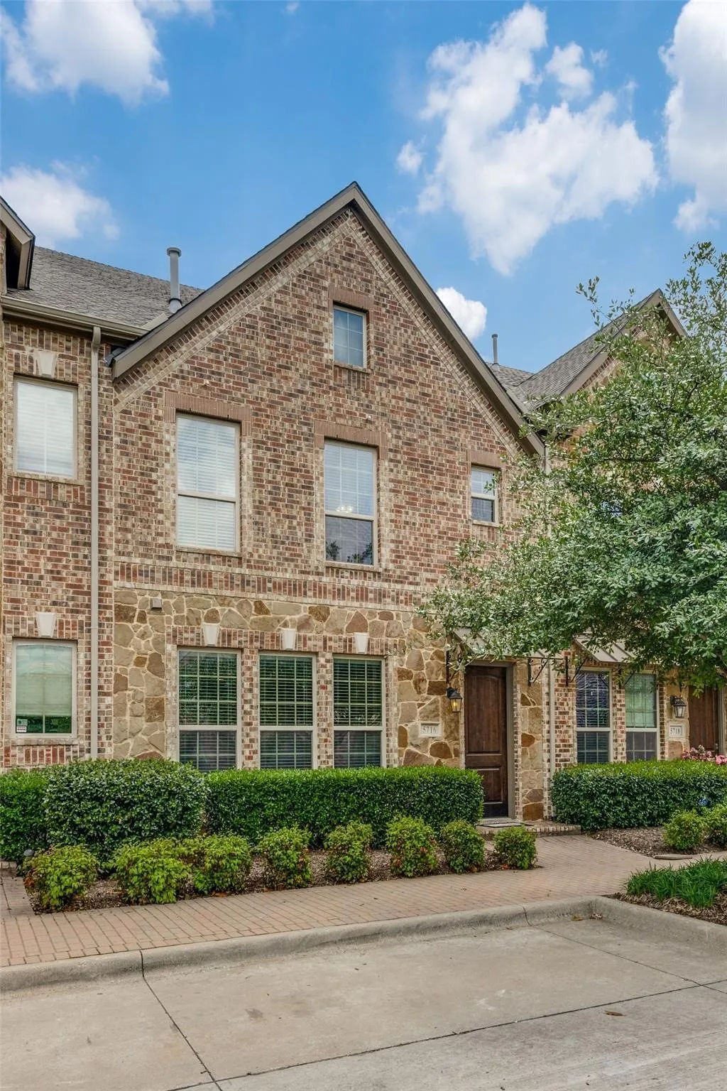 Brick and stone exterior with gabled roof lines