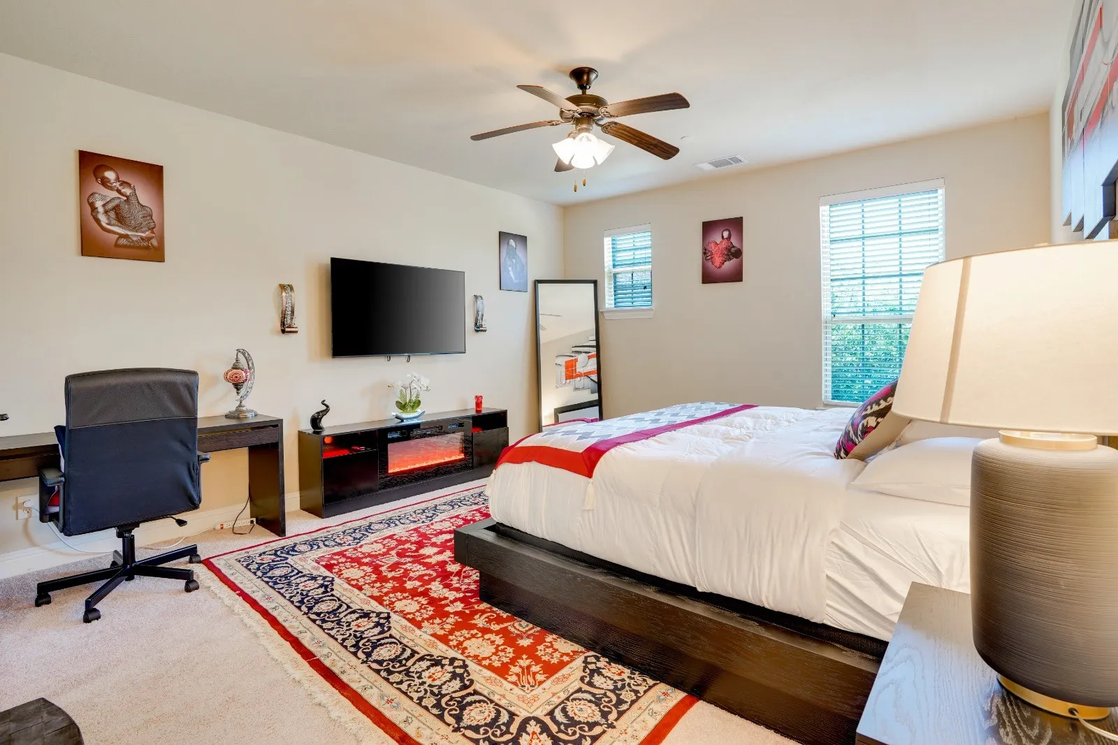 Ceiling fan, multiple windows, built-in desk, built-in media console, wall-mounted television