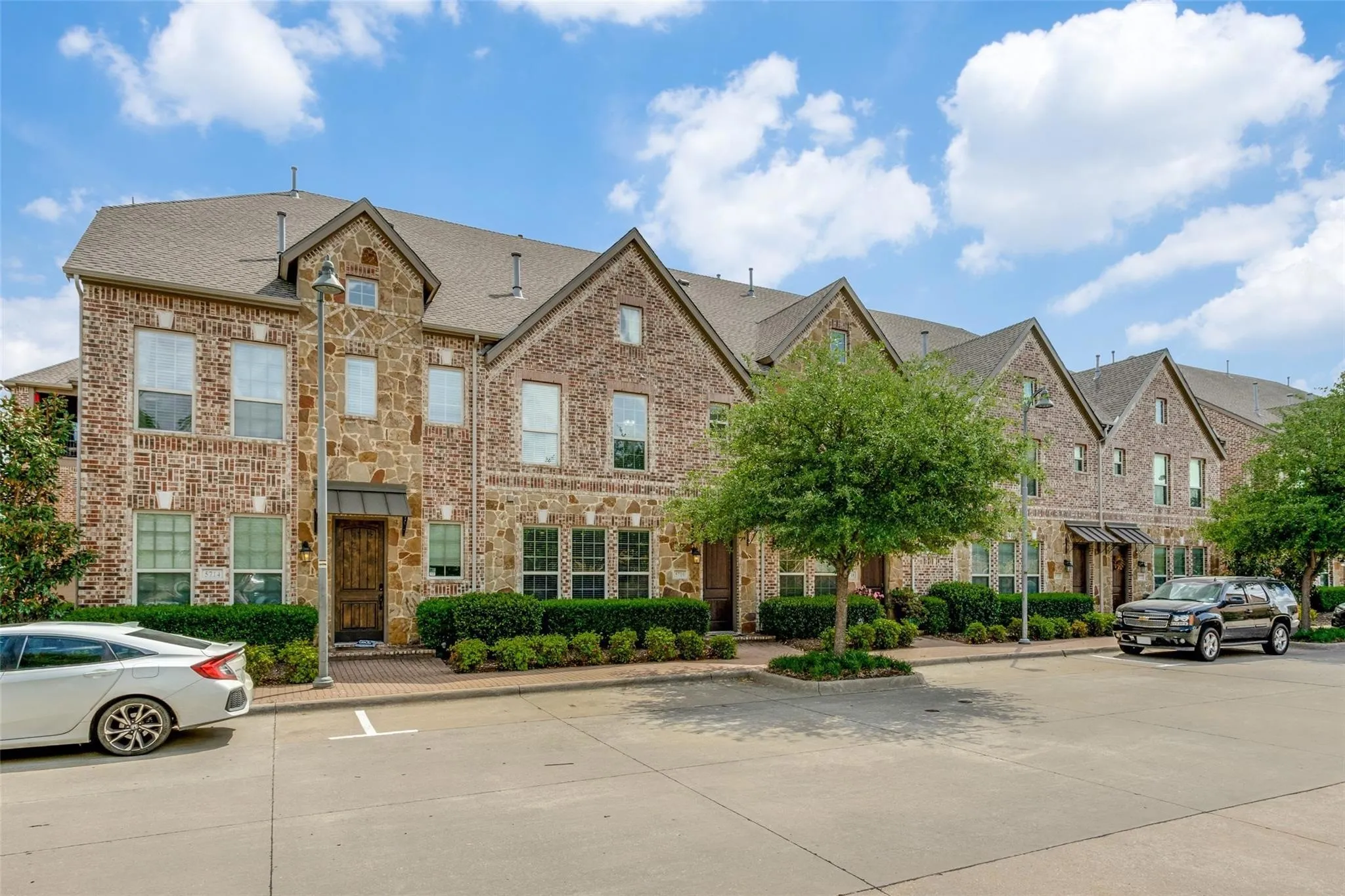 Brick and stone exterior with gabled roofs