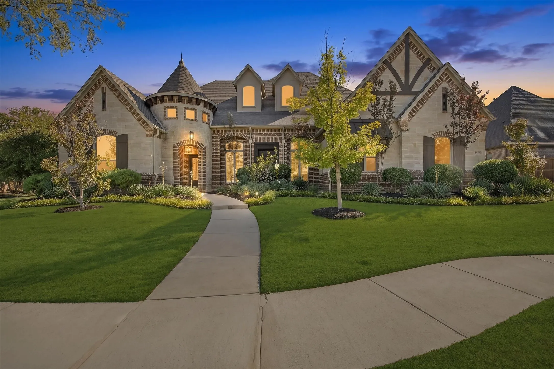 Stone and brick exterior with a turret feature