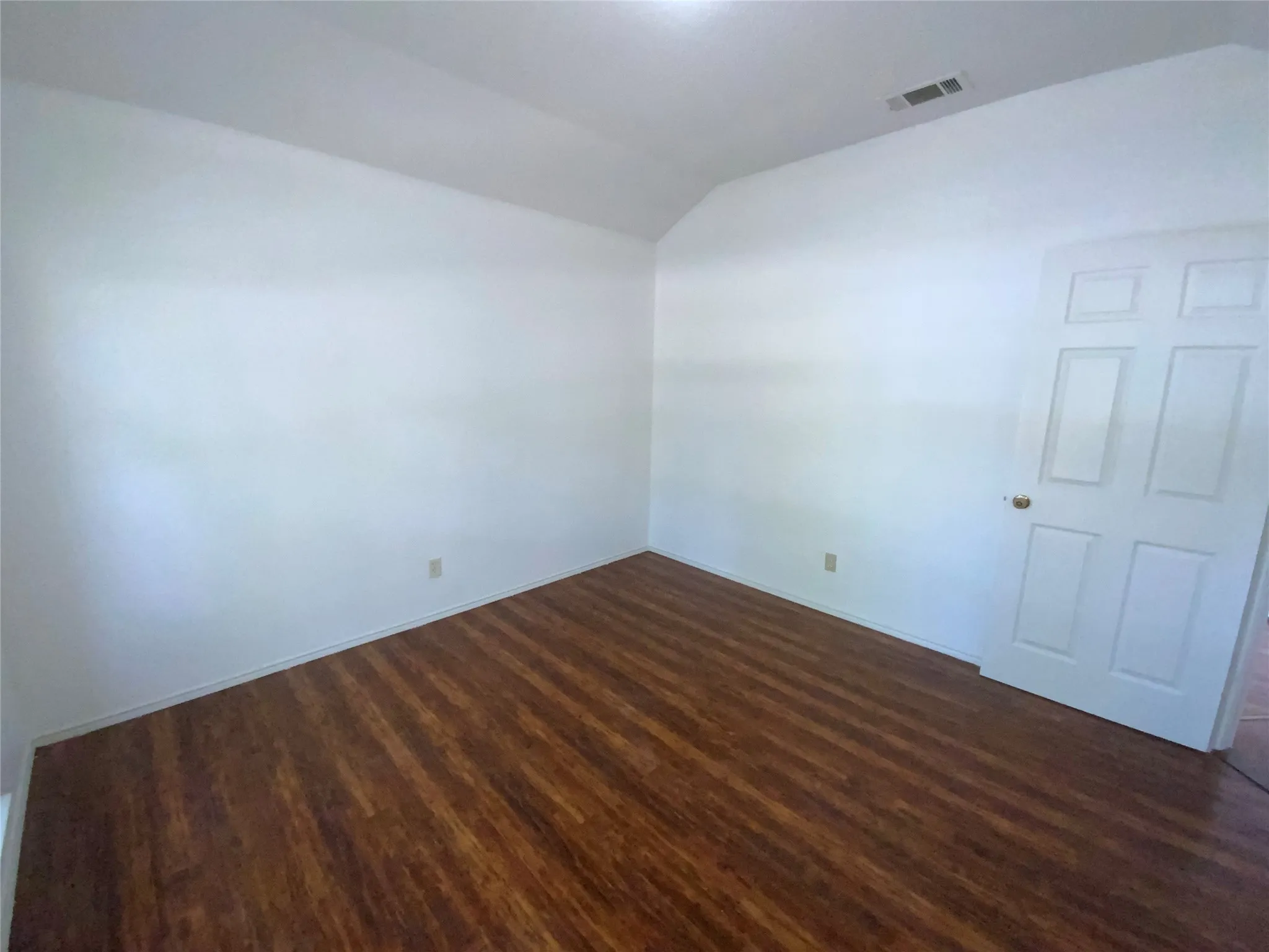 Wood-finish flooring with white walls
