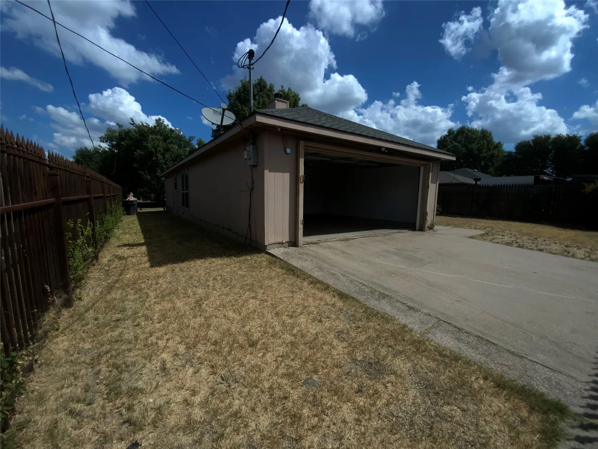 Attached garage structure with open bays