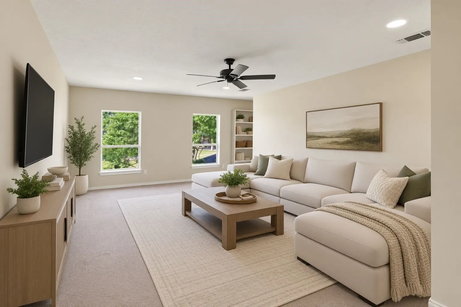 Spacious upstairs living area with abundant natural light, built-in shelving, and plenty of room for a media room, game room, or second family room.