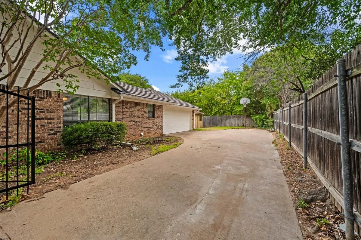 Lots of parking space behind the gate on this driveway!
