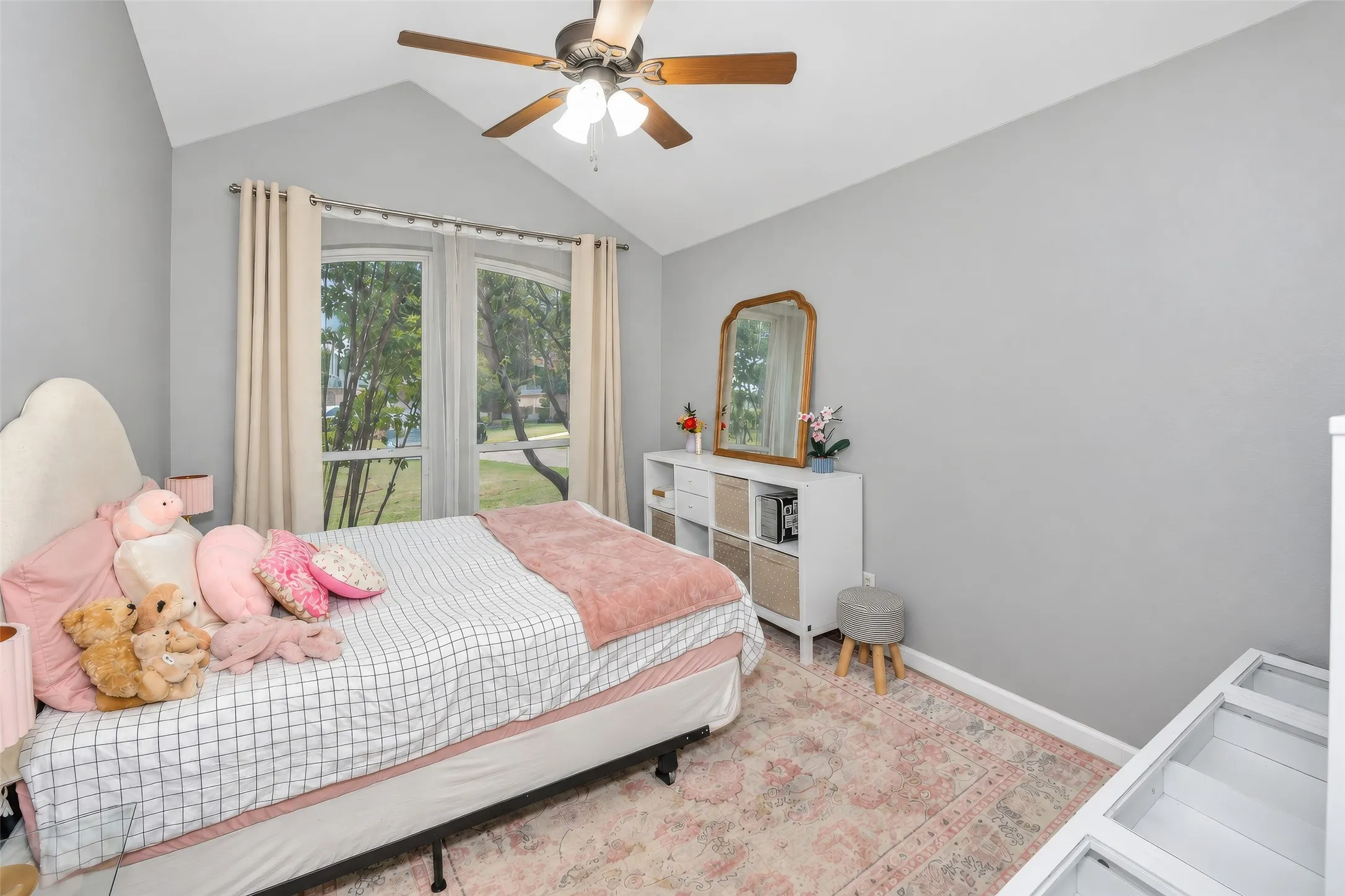 Custom windows offer architectural interest to bedroom 2.