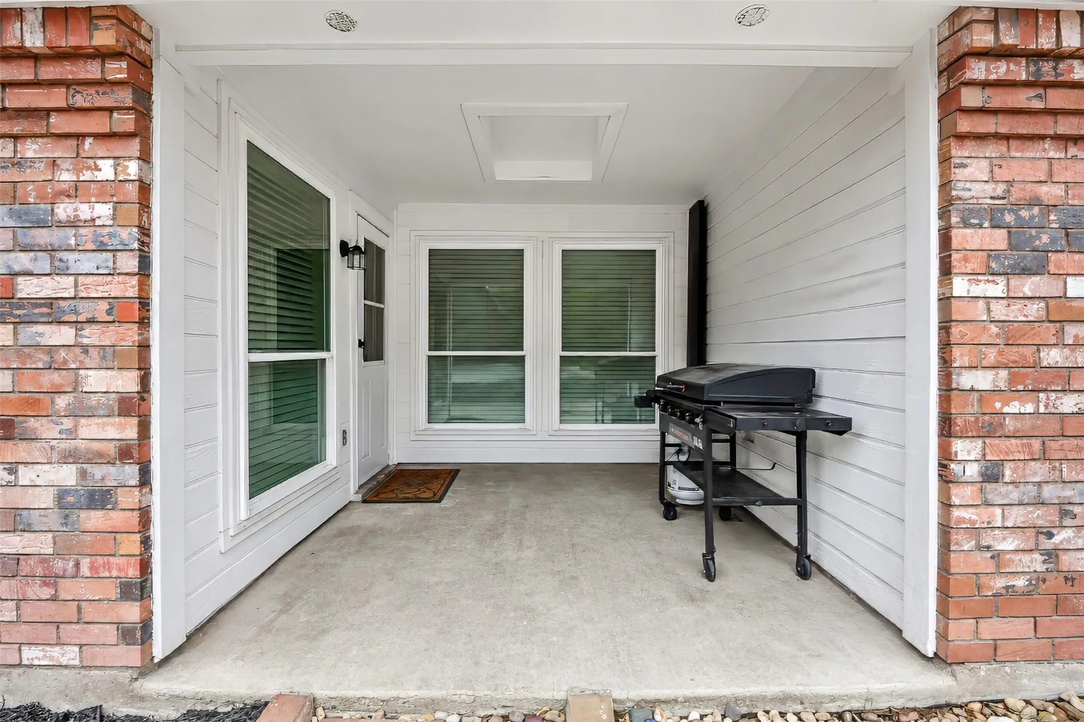 Side porch, perfect for grilling. Custom panels included to make the area weather proof.