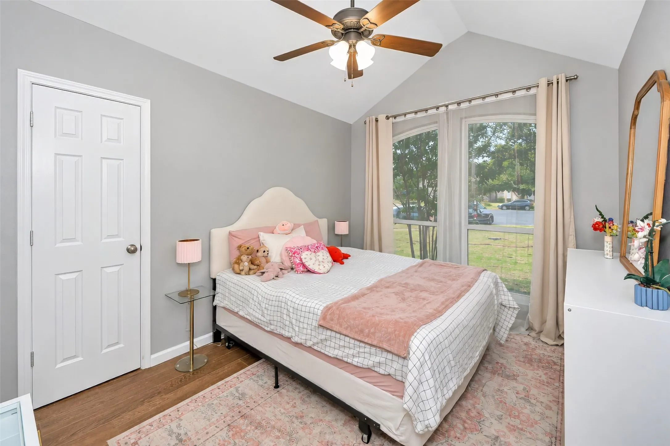 Bedroom 2 offers a vaulted ceiling and walk in closet.