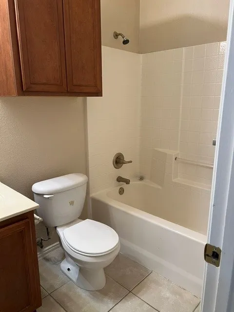 Tub and shower combination with white tile surround