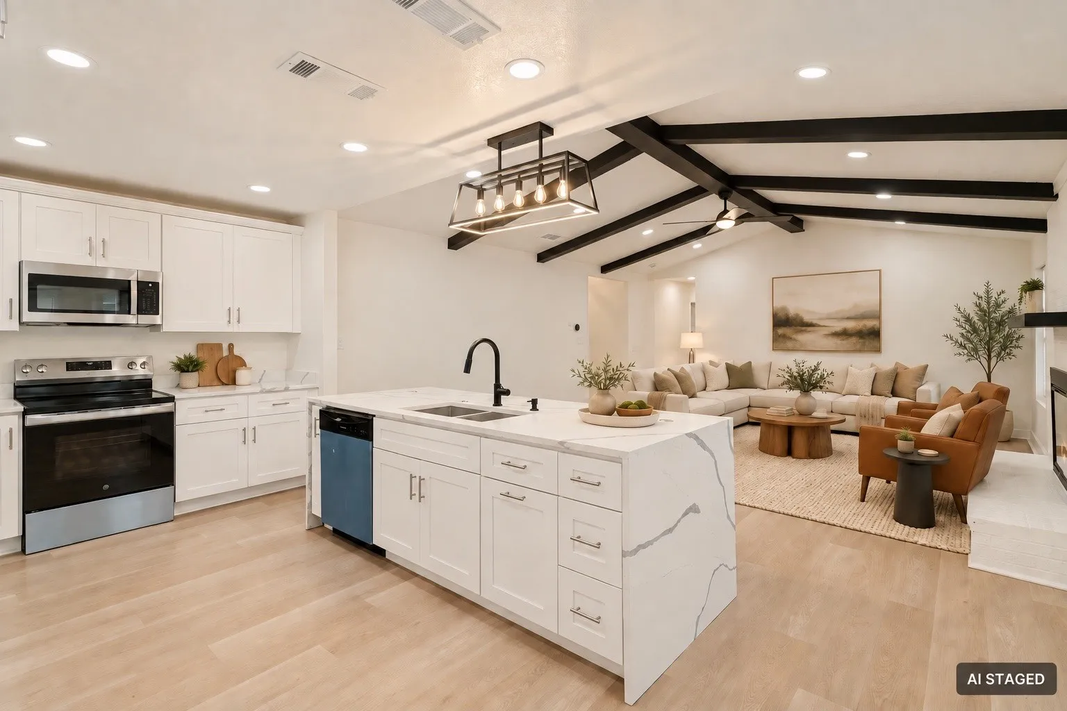 Open-concept living area featuring a kitchen island with stone countertops, stainless steel appliances, wood-finish flooring, white cabinetry, and vaulted ceilings with exposed beams