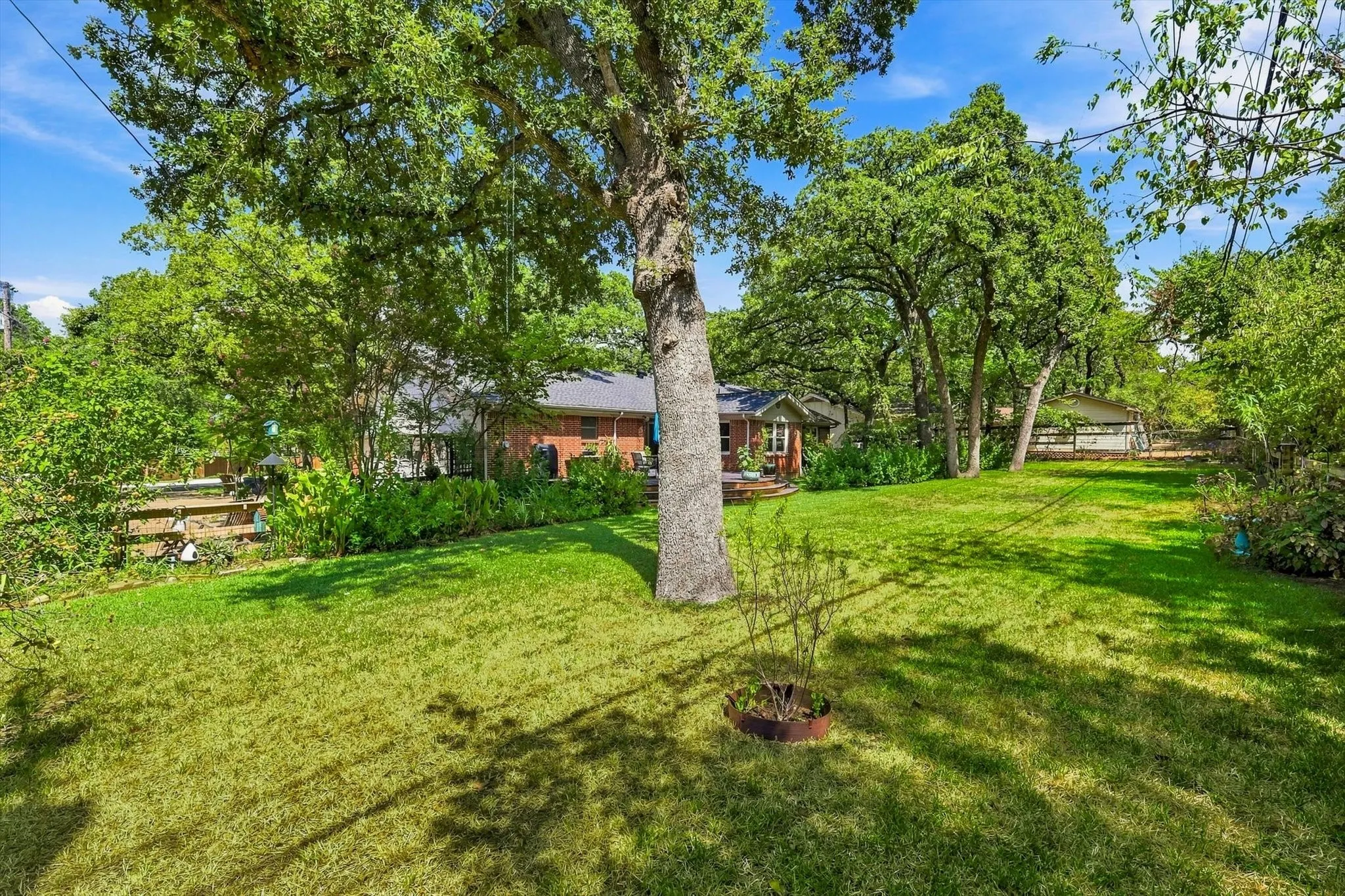 Large, pool sized backyard offers a serene escape from the every day hustle and bustle.
