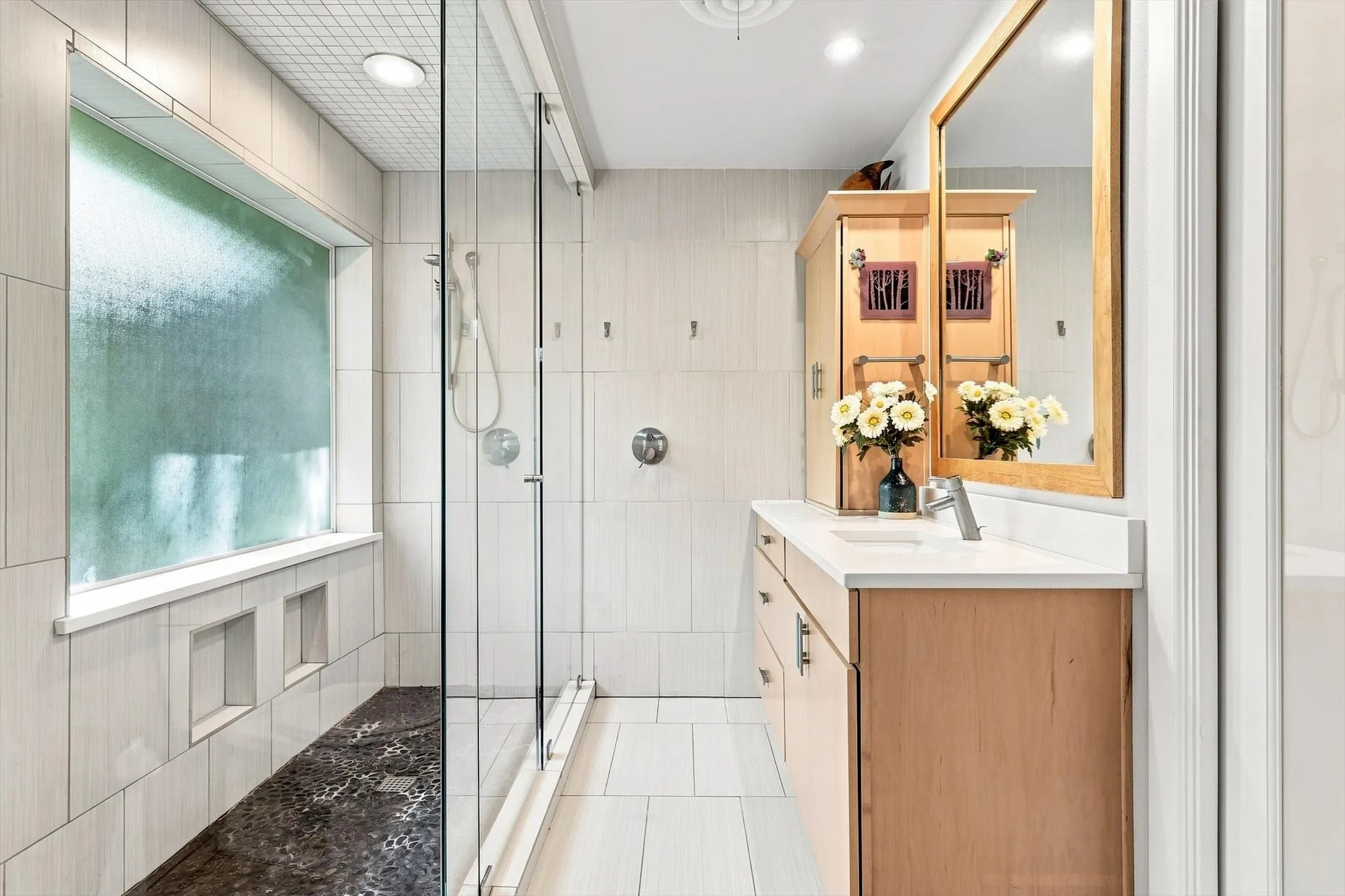 Primary bath offers the perfect escape with a generous sized shower with outside of the shower controls (that can be set to maintain the perfect temperate without having to adjust it each time). Never get wet again when trying to turn on the shower.