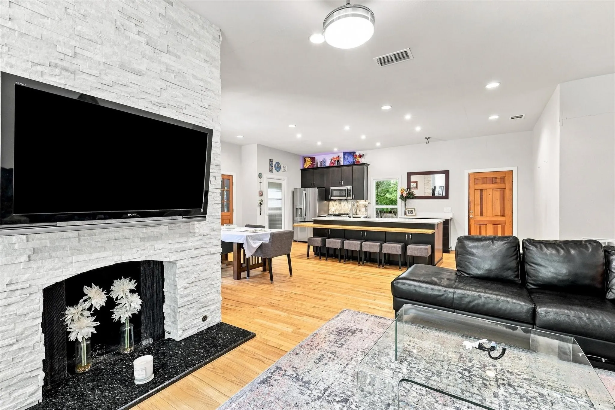 Beautiful brick fireplace features a gas start and a granite hearth.