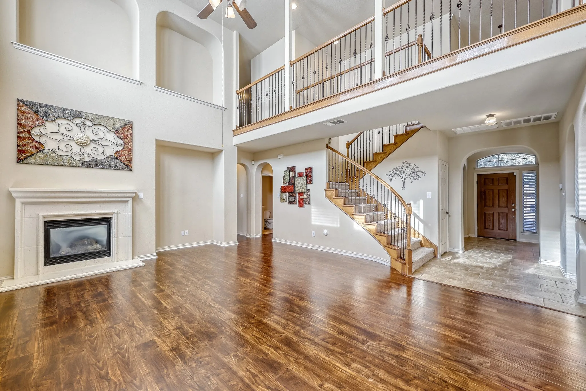 Wood-finish flooring throughout, with a tiled entry