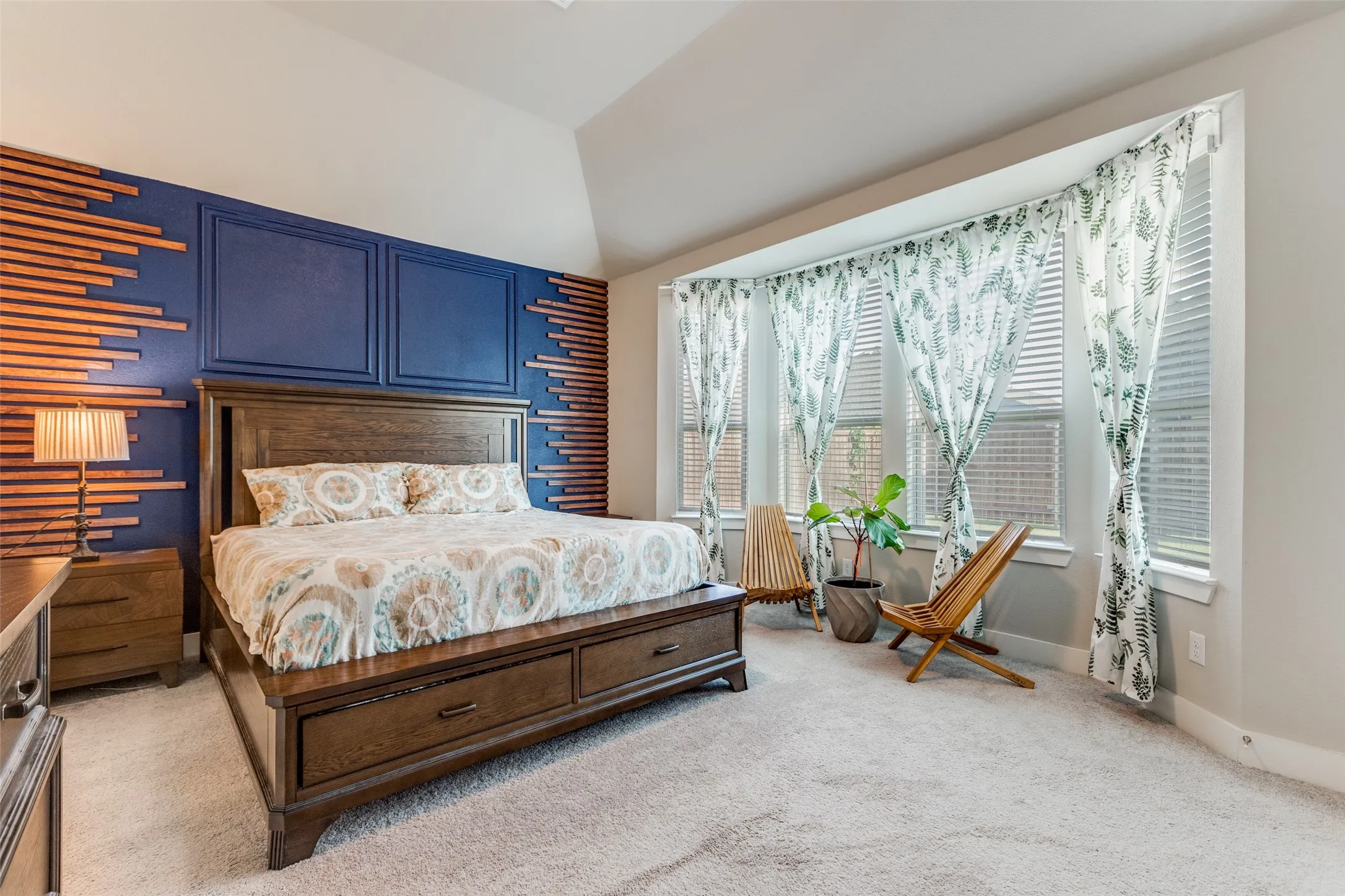 Bedroom featuring light colored carpet and baseboards