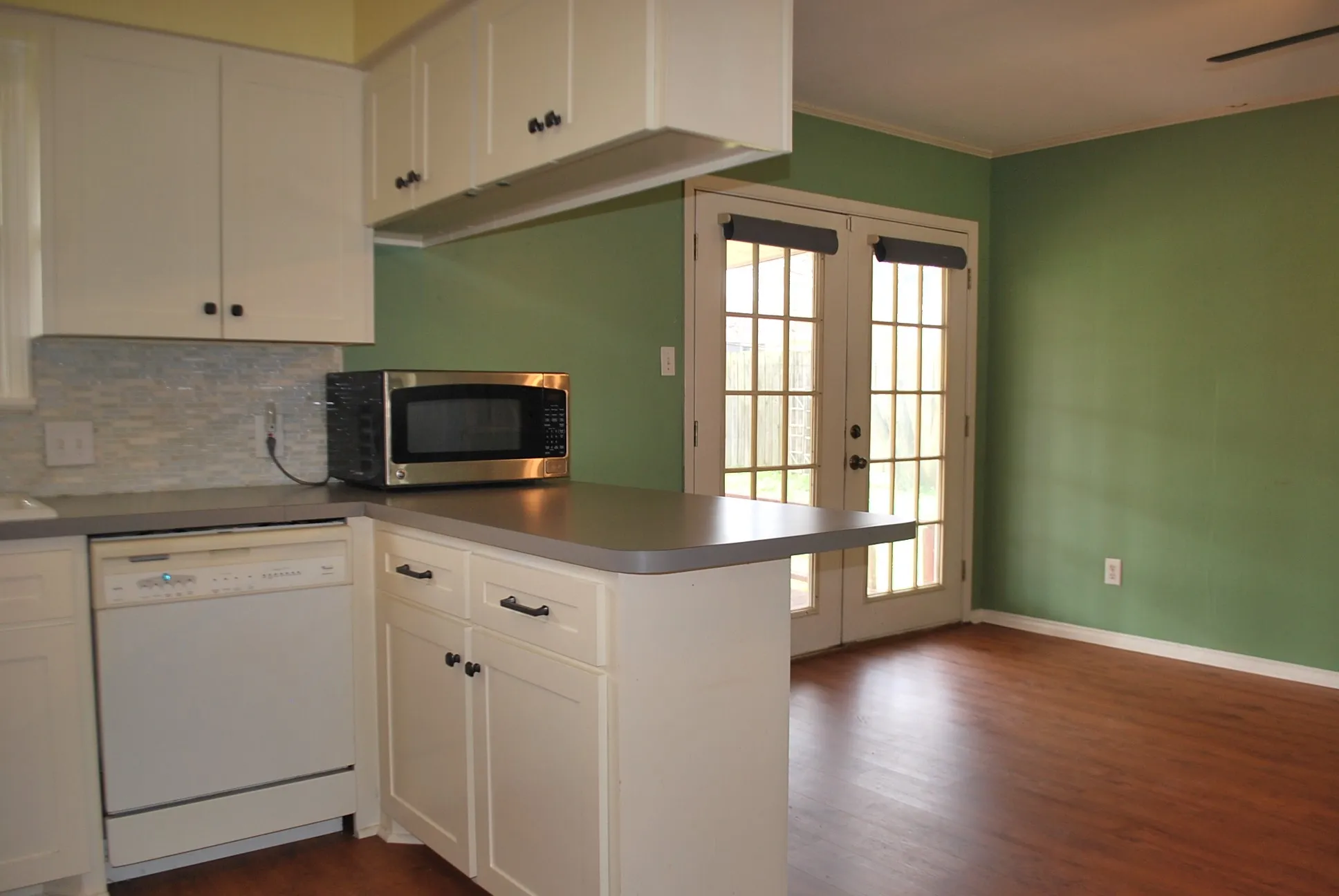 White cabinetry with dark hardware