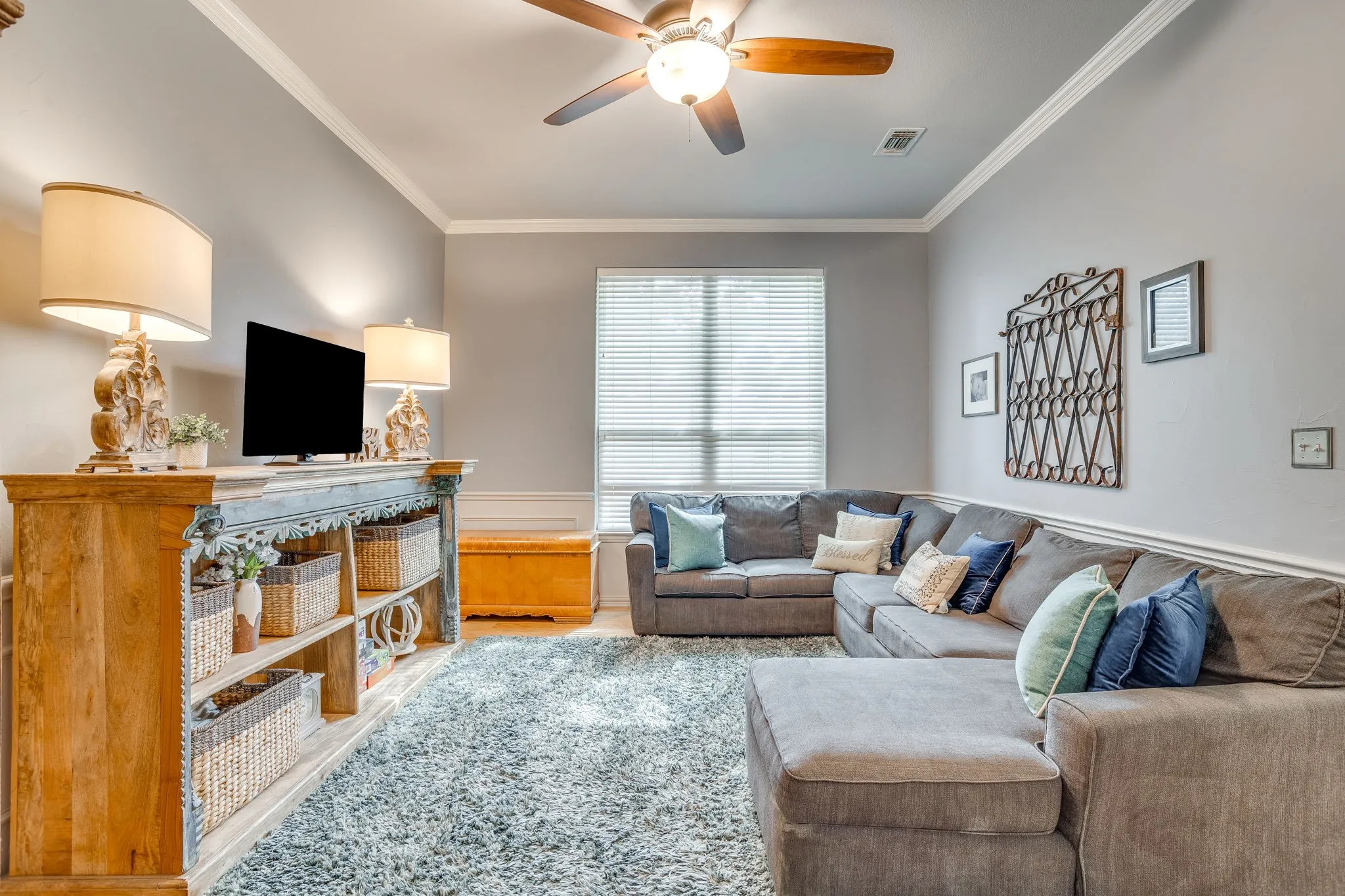 Second Living off entry with Recessed lighting and ceiling fan overhead