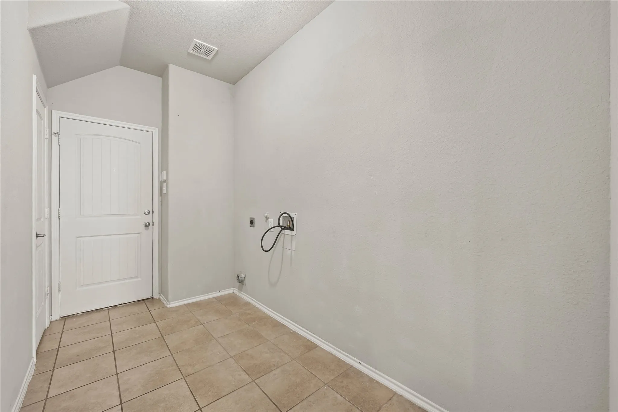 large laundry room with storage closet