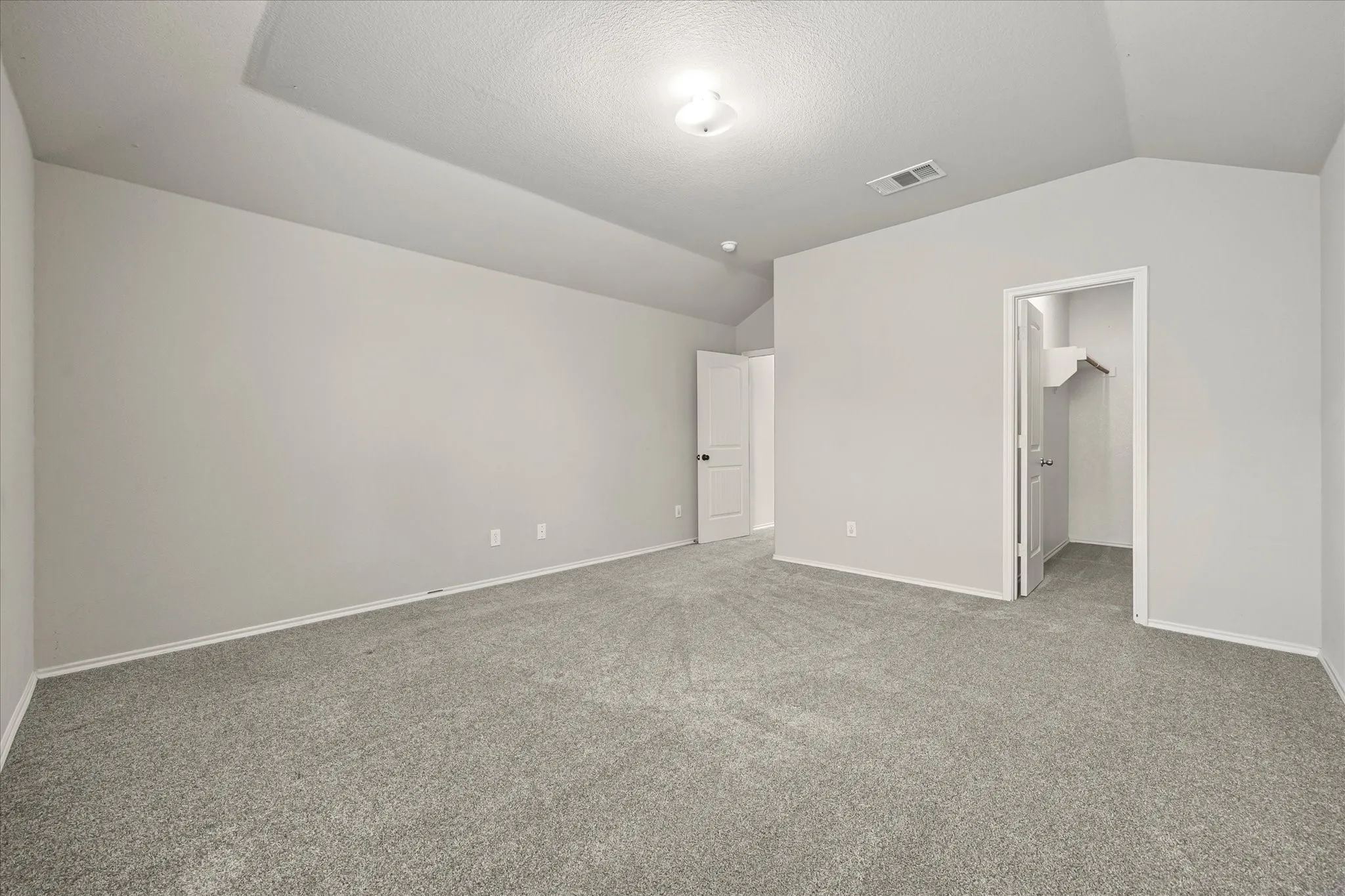 upstairs bedroom with walk in closet