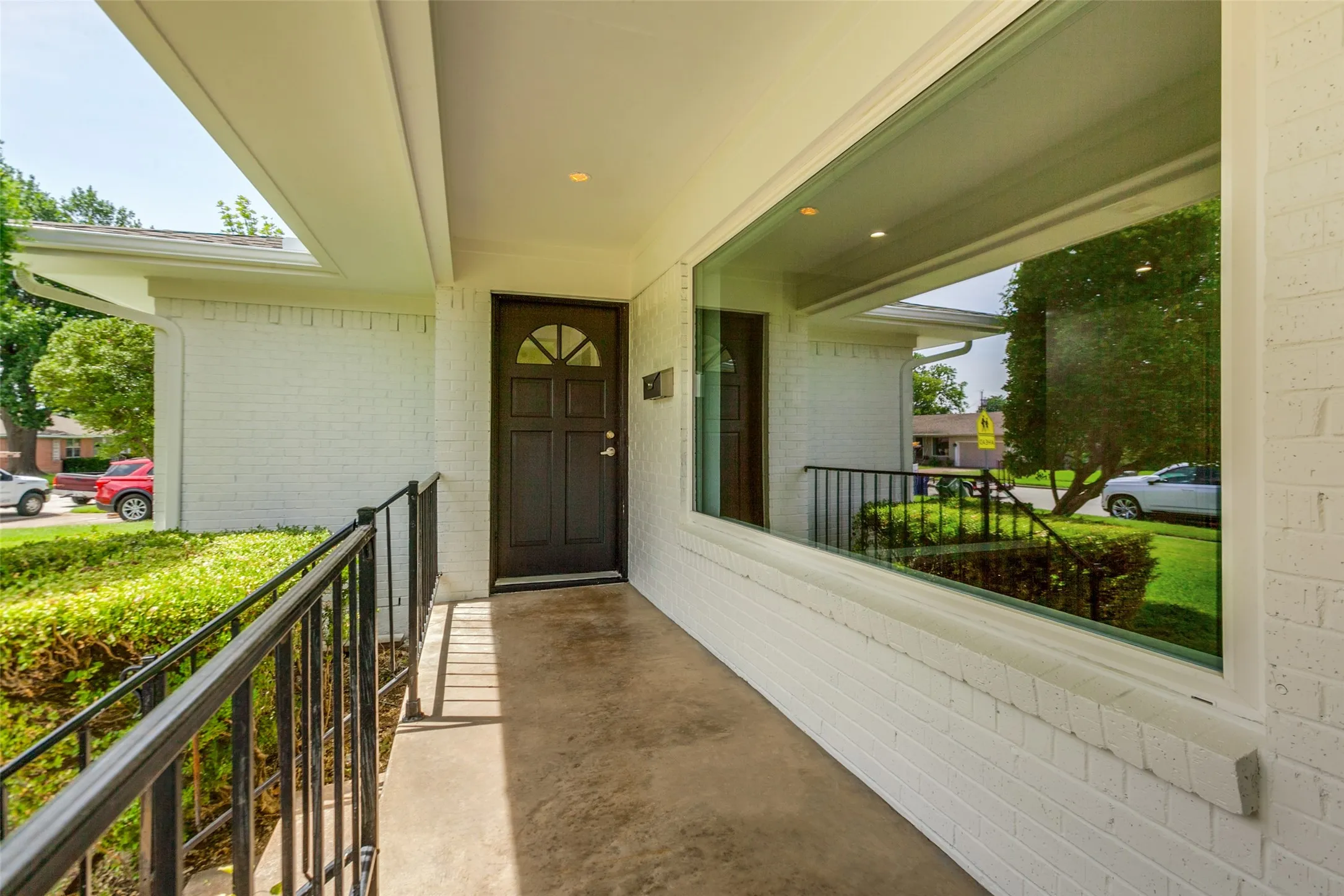 Covered front porch and freshly painted front door