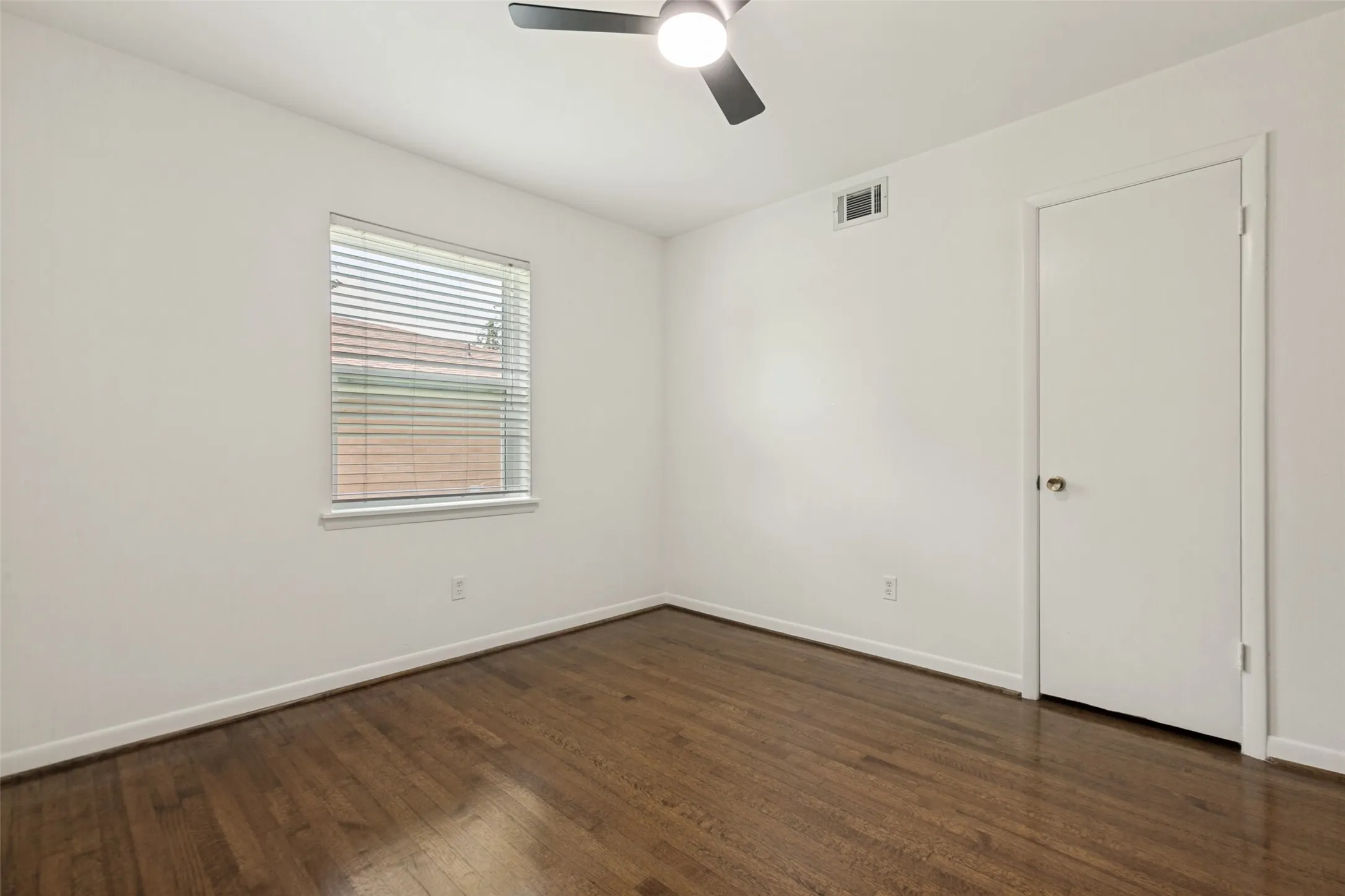 Bedroom with views of side yard