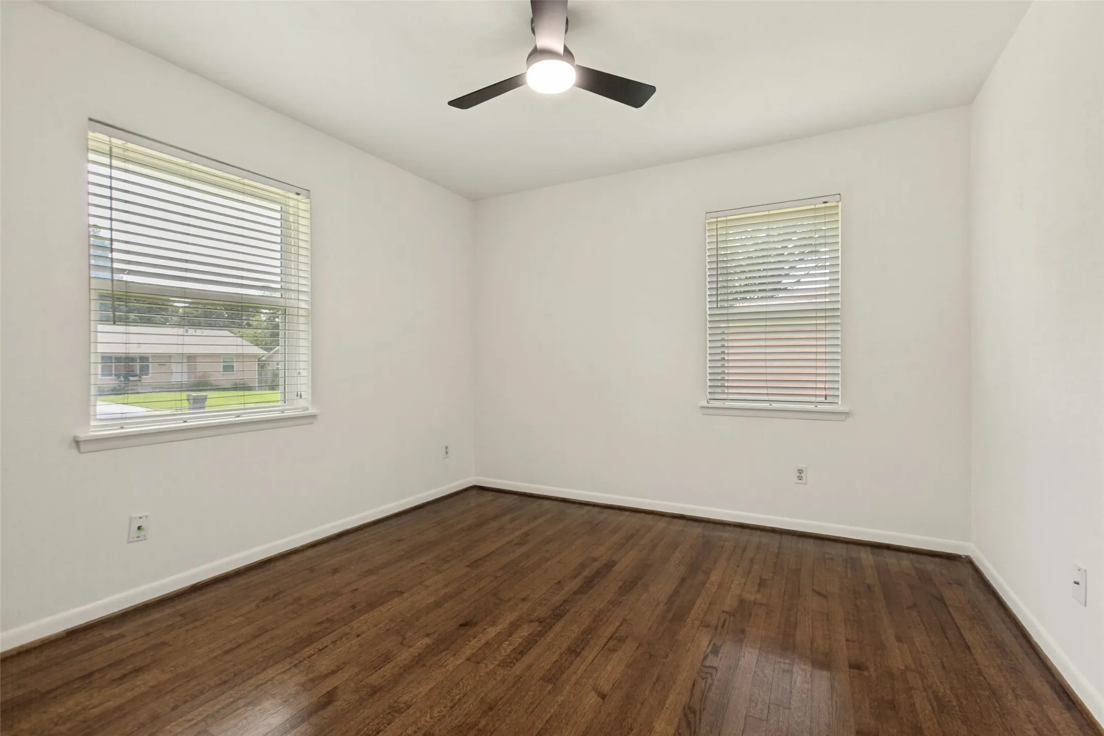 Bedroom with views into front yard and side yard