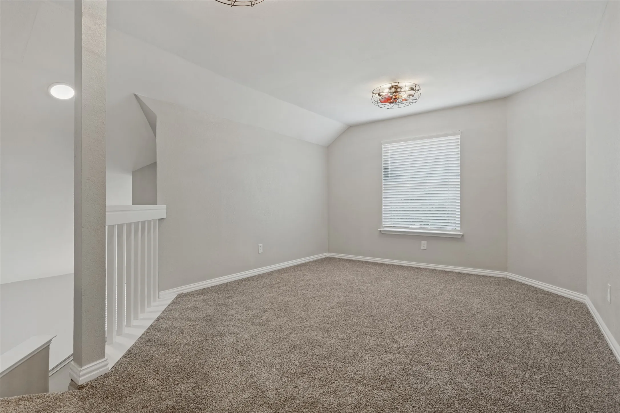 This spacious family room lends itself to another living area, a game room or play room or gym area.