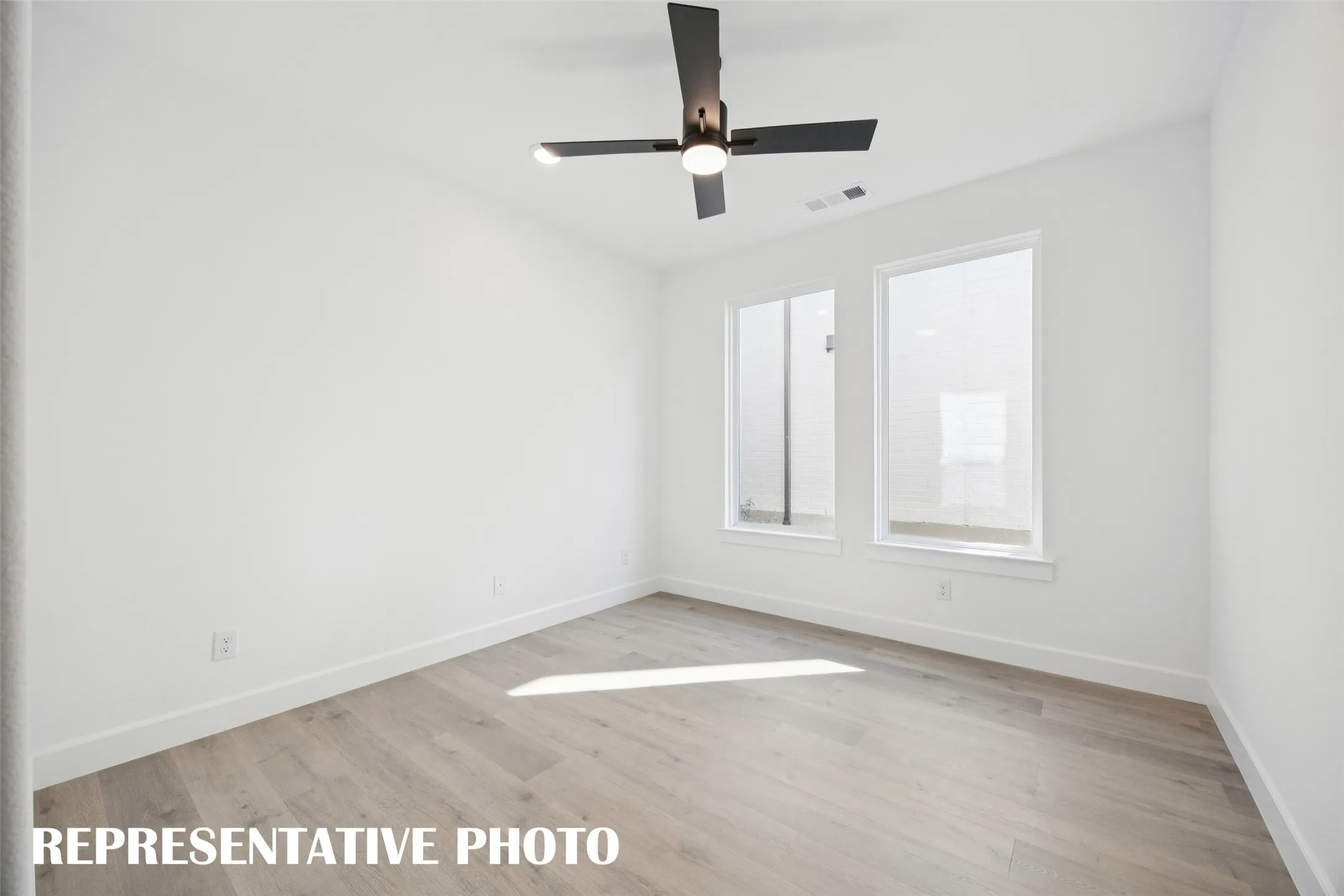 The professional needing to work from home will appreciate this light filled, private home office.  REPRESENTATIVE PHOTO