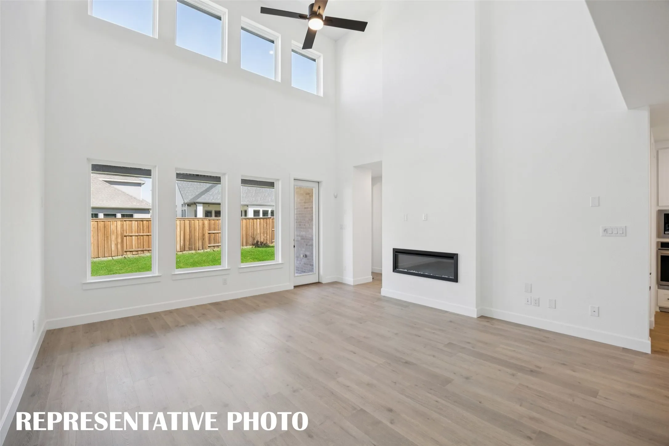 A spacious and light filled family room is the perfect place place for friends and family to gather.  REPRESENTATIVE PHOTO