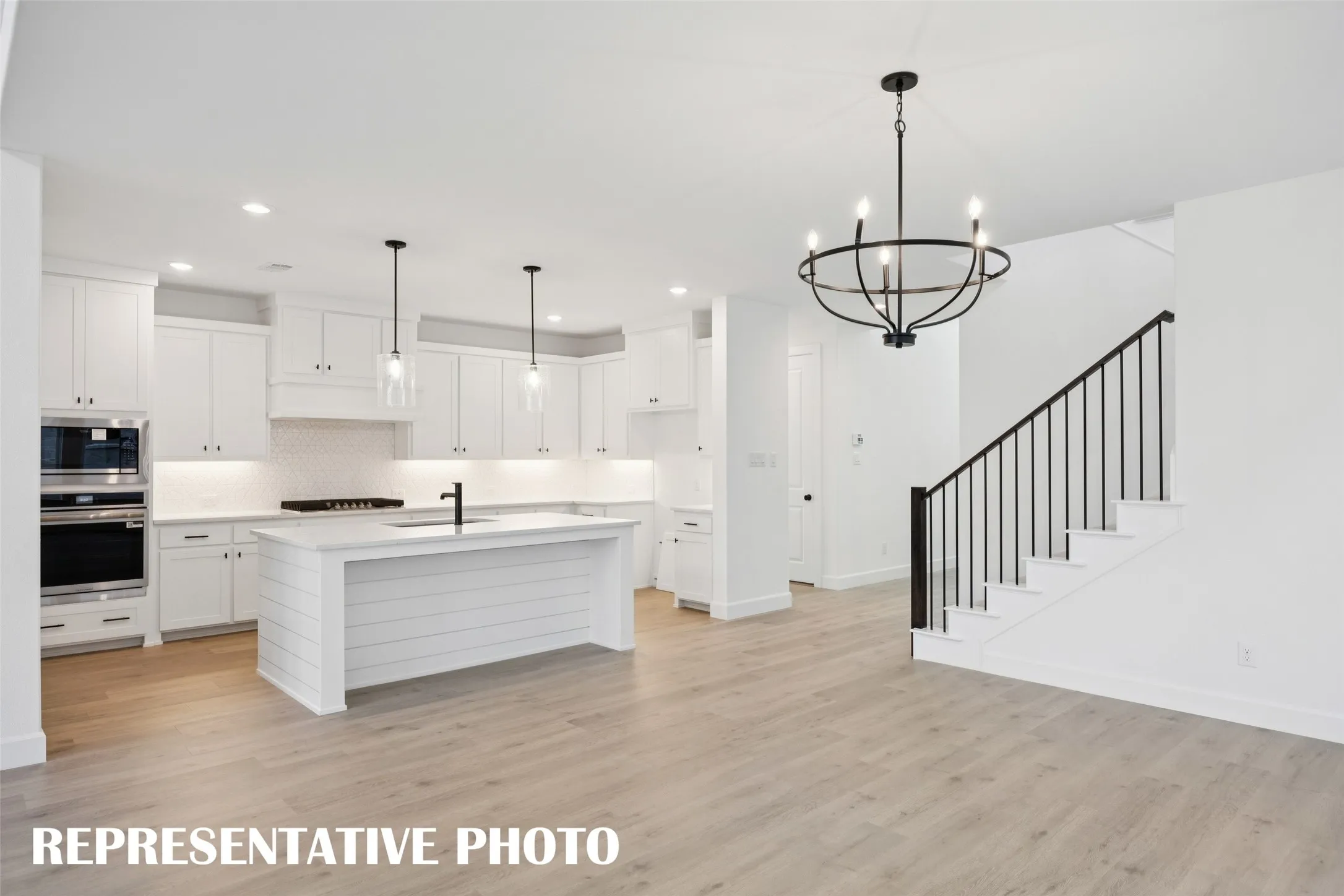 Open and flowing, entertaining is a breeze in our Rochelle floor plan.  REPRESENTATIVE PHOTO