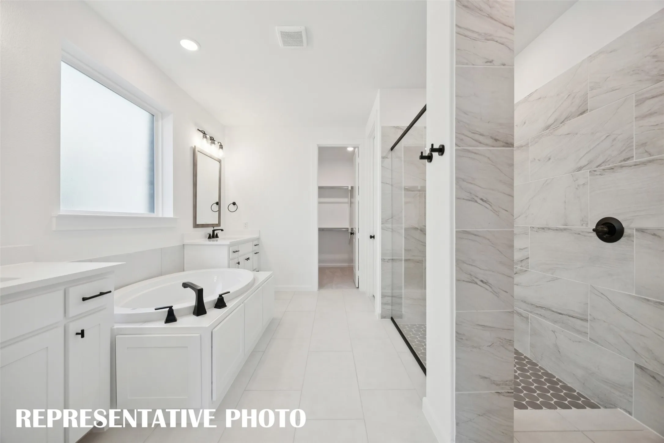The oversized, walk in shower with drying area is the perfect place to start or end your day. REPRESENTATIVE PHOTO