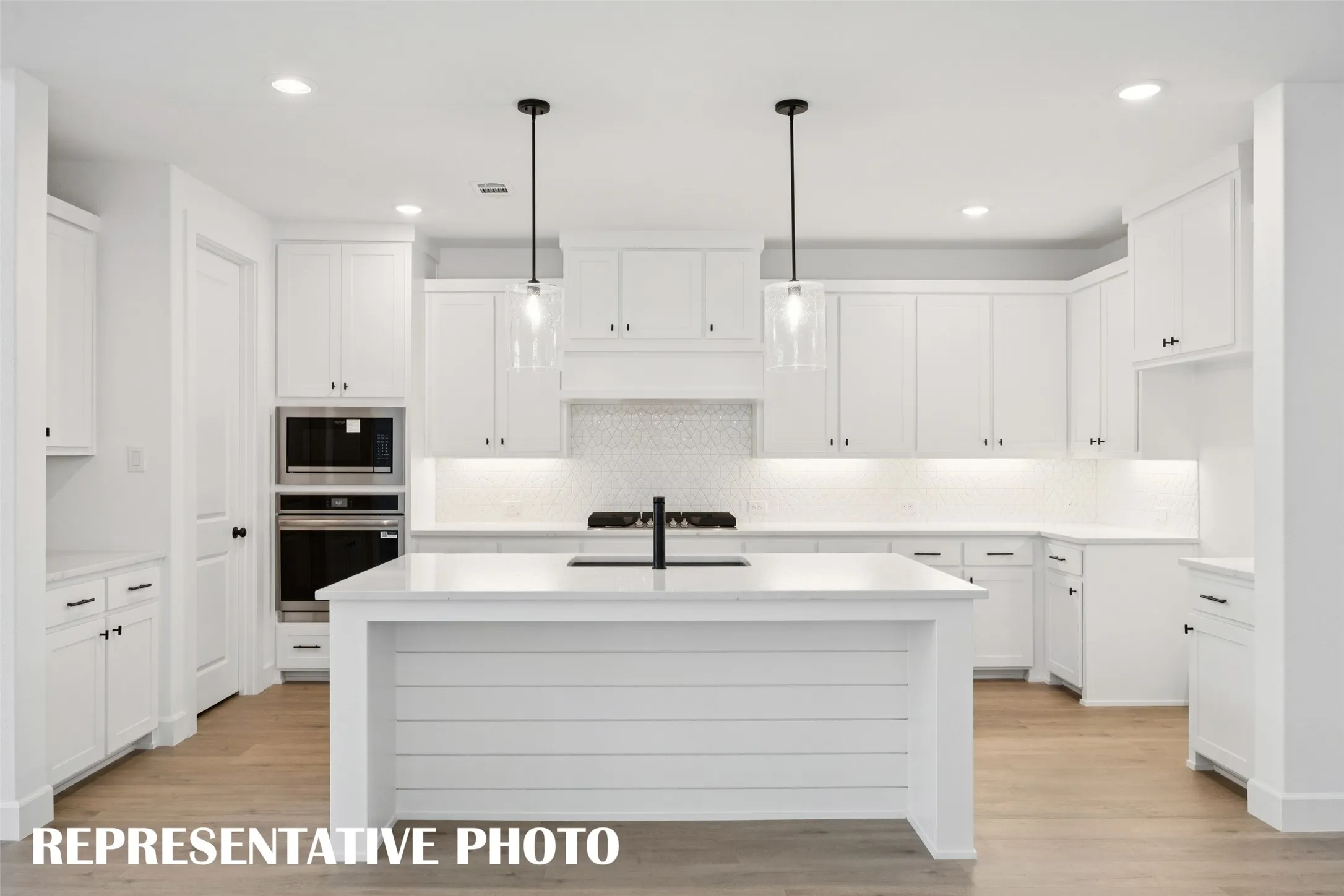 With ample storage and prep space, all the chefs in the family will love gathering in this dream kitchen!  REPRESENTATIVE PHOTO