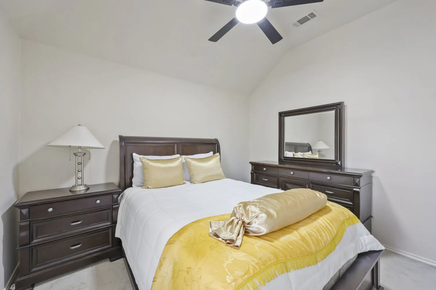 Vaulted ceiling with a ceiling fan