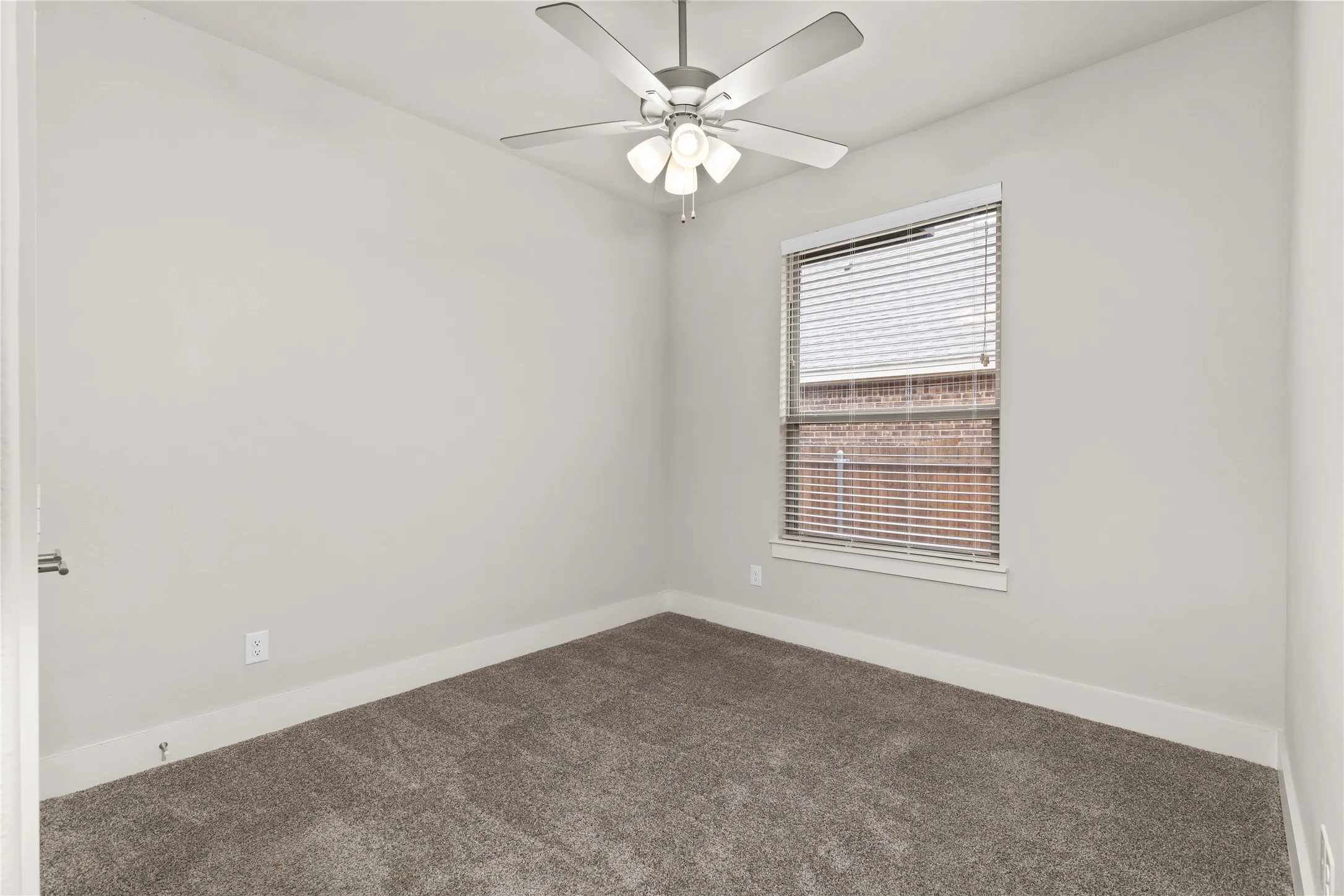 Neutral wall tones with a ceiling fan