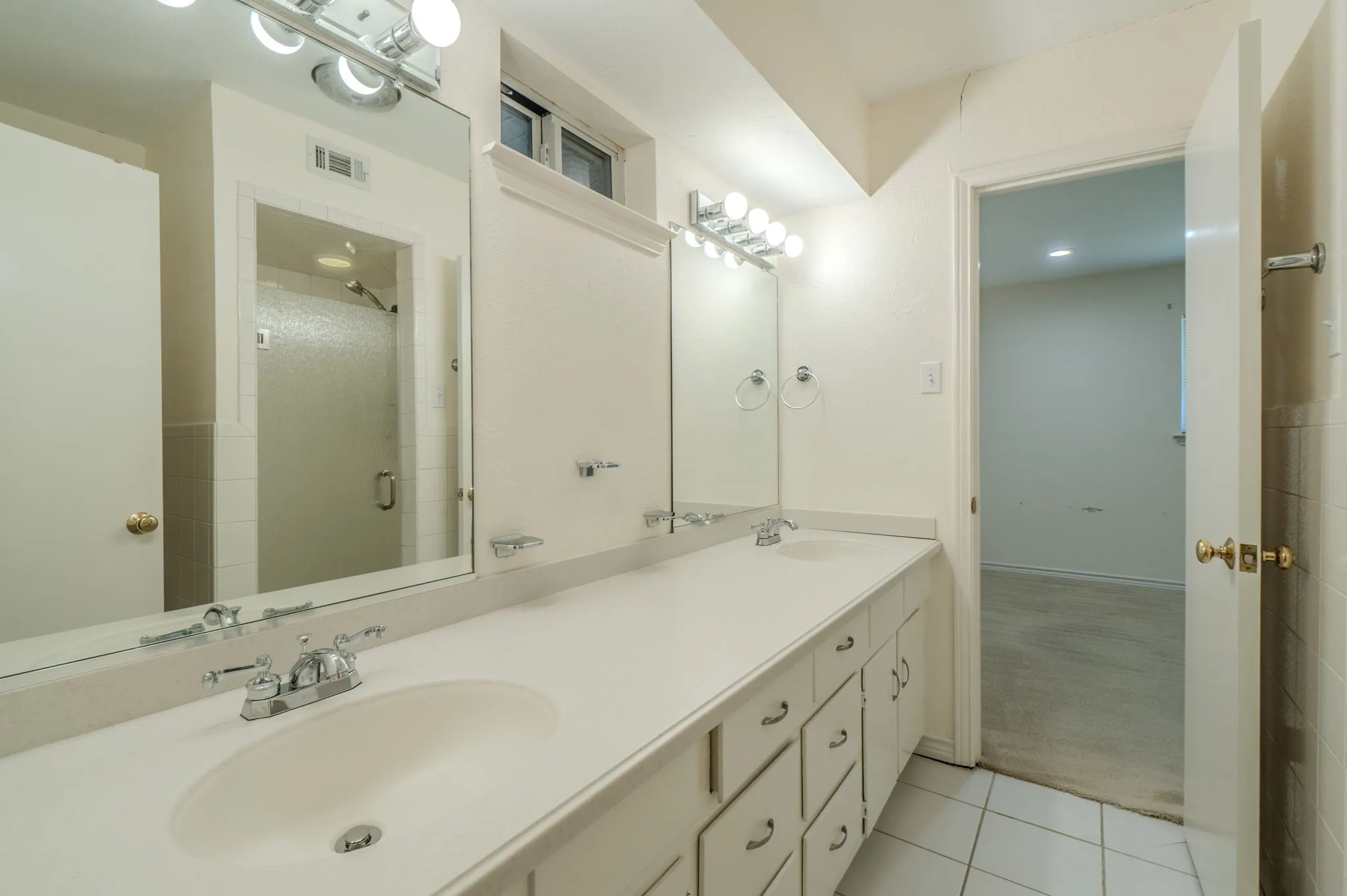Jack n Jill Dual vanity with integrated sinks and chrome fixtures