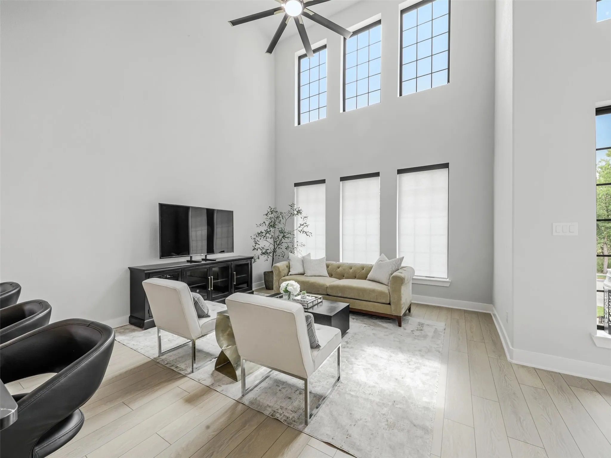 Spacious living room with electric blinds and more!
