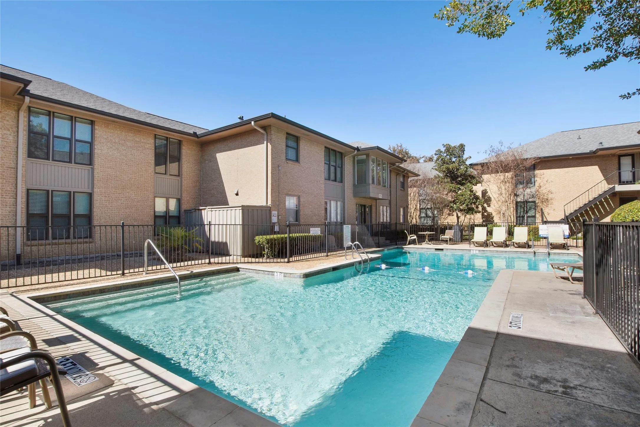 Community pool with a patio area