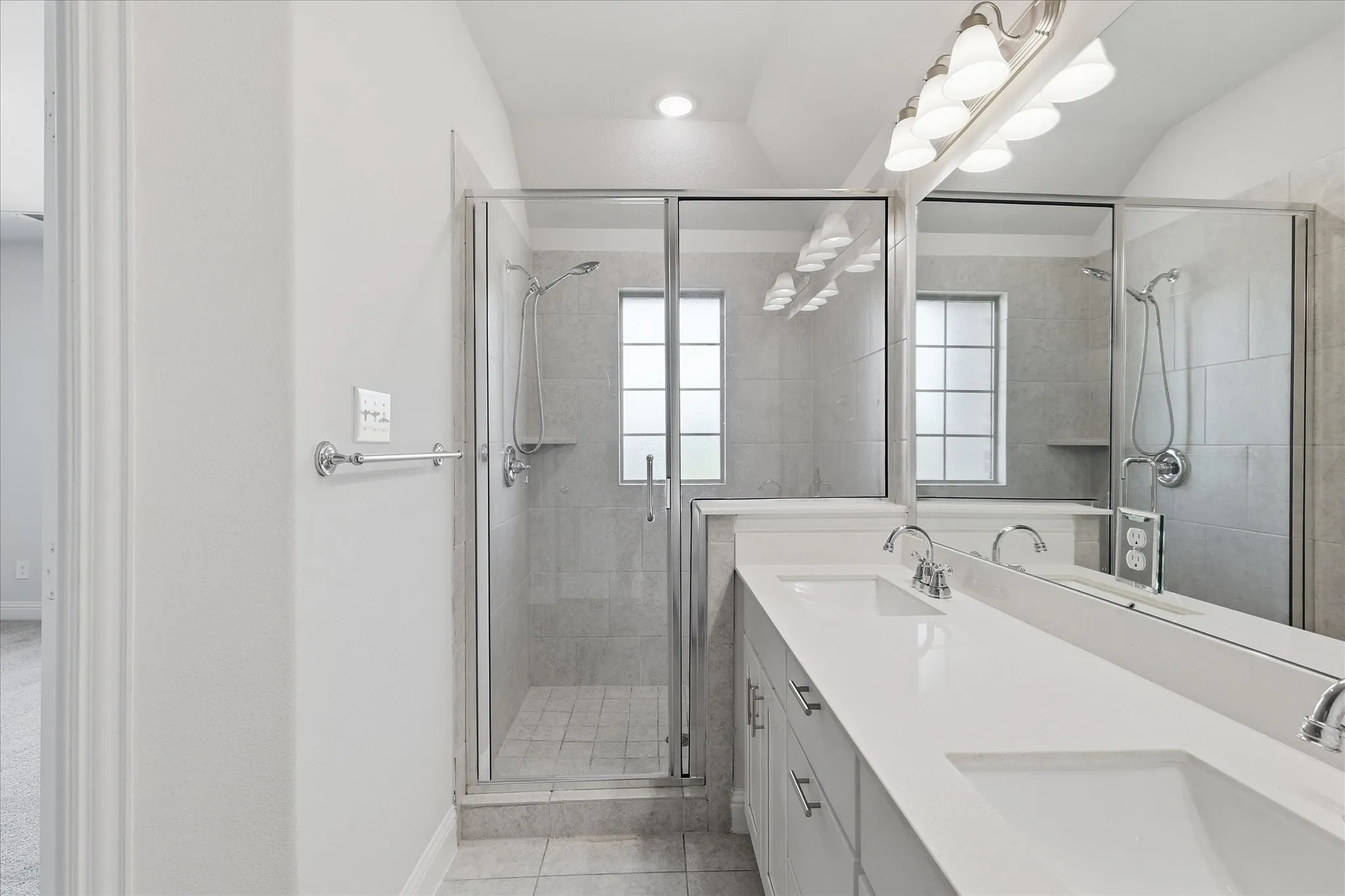Dual vanity with integrated sinks and chrome fixtures