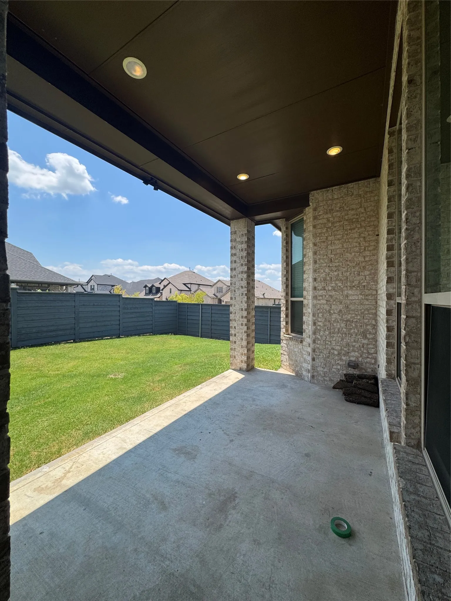 Fenced backyard featuring a patio area