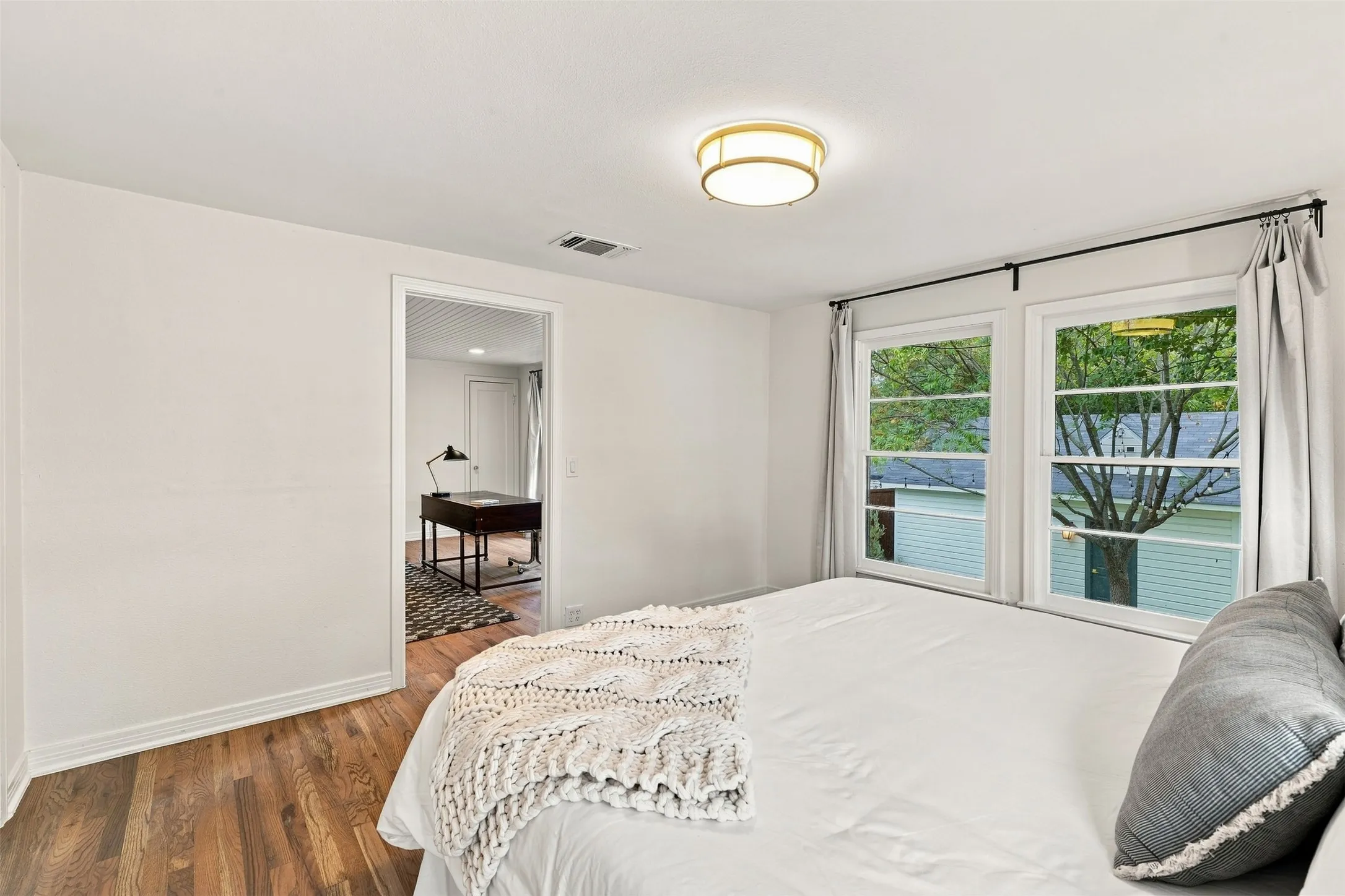 Stunning bedroom in guest quarters that overlooks the back yard