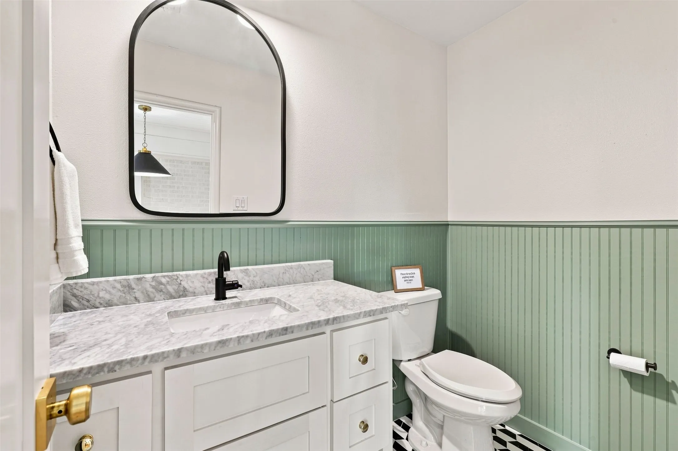 The bathroom creates a timeless space, while the blend of old and new.