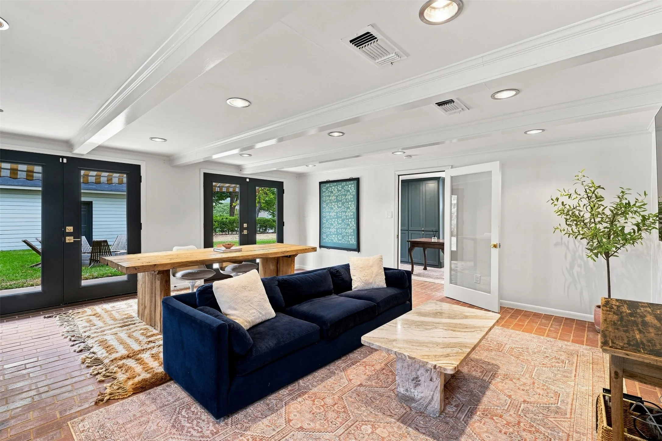  Positioned at the rear of the home, the basement opens through beautiful doors to a tree lined backyard, creating a seamless connection to the outdoors