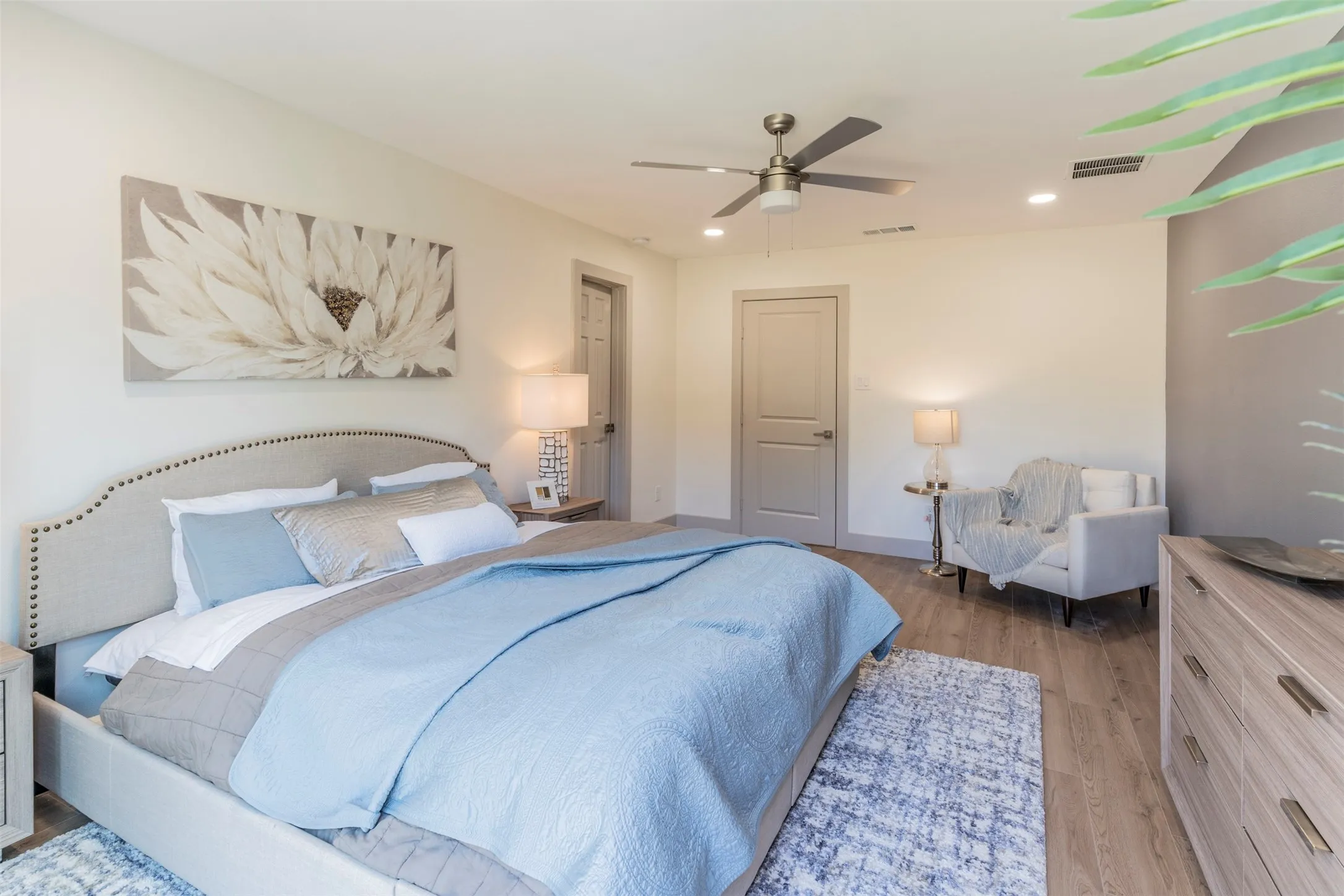 Recessed lighting, wood-finish flooring, ceiling fan, and solid interior doors