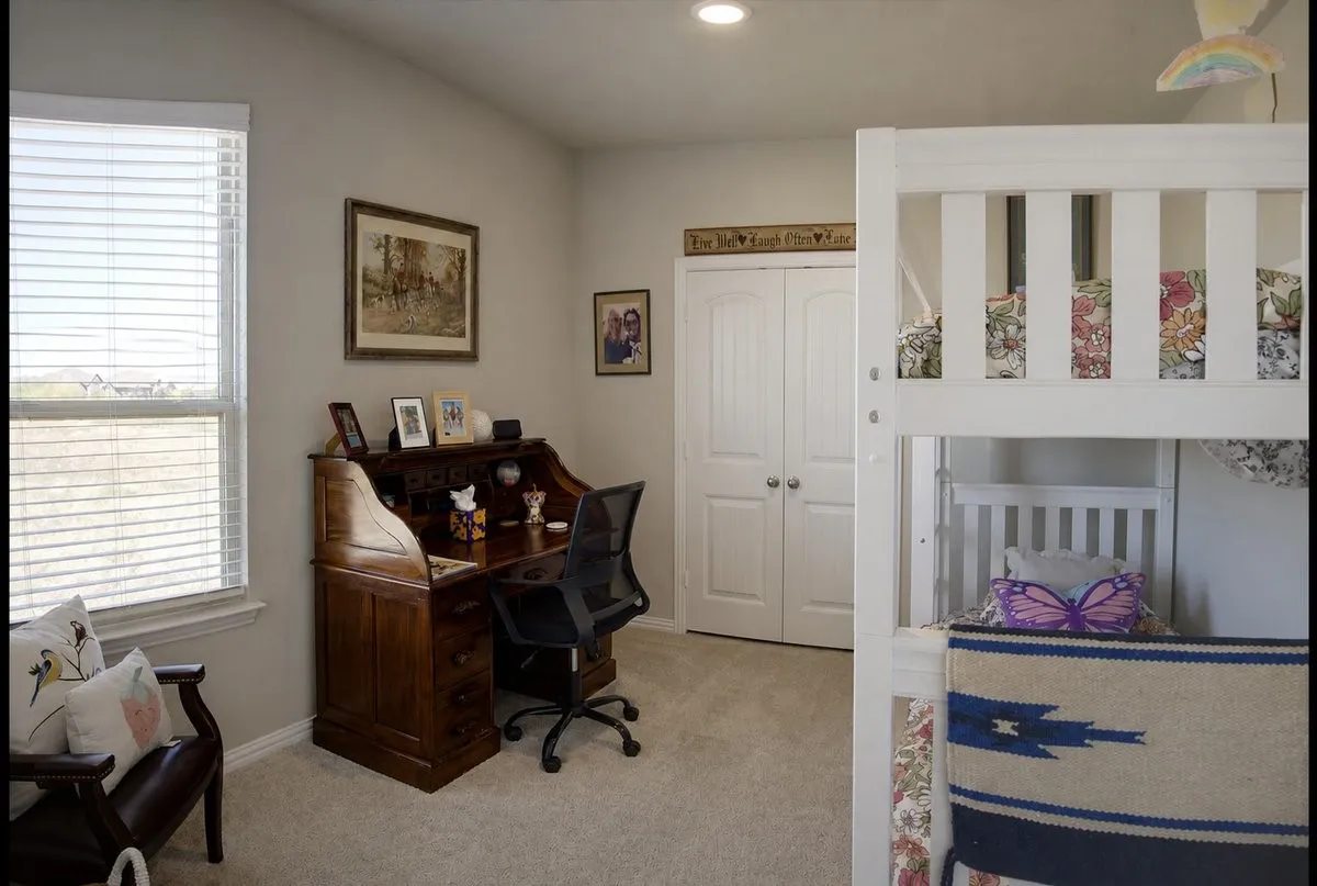 Vaulted ceiling, recessed lighting, carpet flooring, window with blinds, bi-fold closet doors